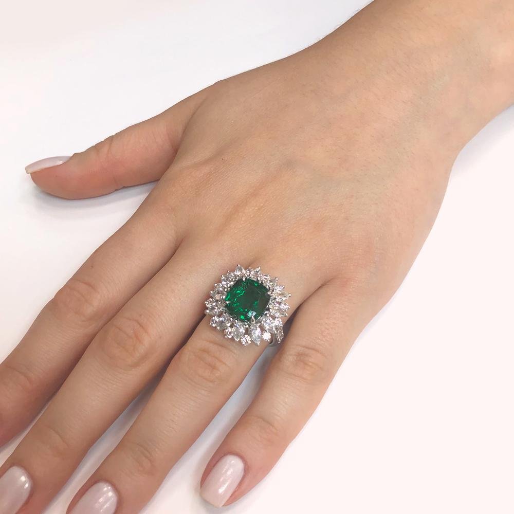 This brilliant sunburst style ring is crowned with a green cushion cut emerald 3.13 carat stone from Zambia.
Accented by round and pear diamonds 4.75 carat total. 
Diamonds are white and natural and in G-H Color Clarity VS.
A stylish Art Deco