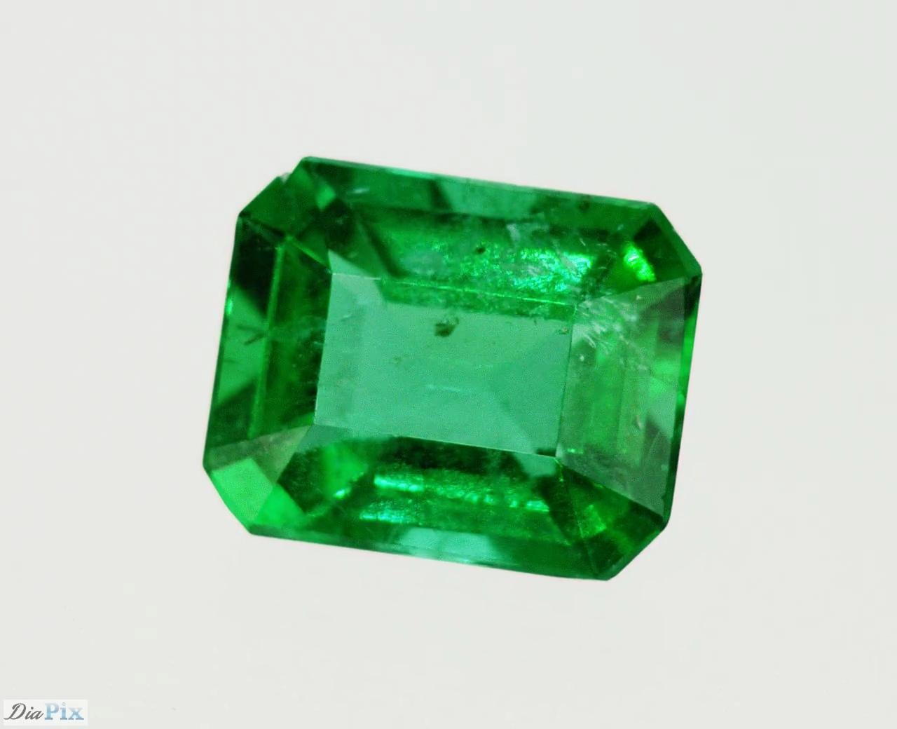 Emeralds are naturally porous and inclusive stones, with surface reaching fractures and in order to improve its clarity, it is a common and widely accepted practice in the industry to fill those fractures with oil or resin. Those materials are