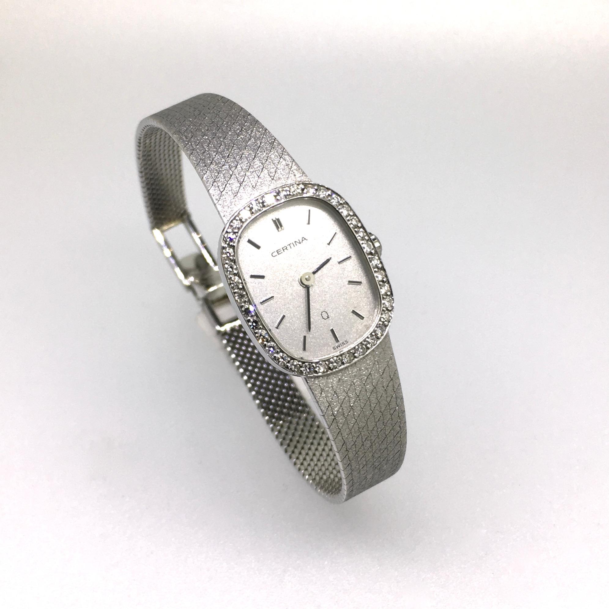 Watch, 18 carat White Gold, set with 36 round cut Diamonds, Certina, Vintage, 1983. Close to Oval shaped case, 18 carat white gold case and bracelet. 18 carat hallmarks. The first collection with very slim Swiss Quartz movement. This watch in
