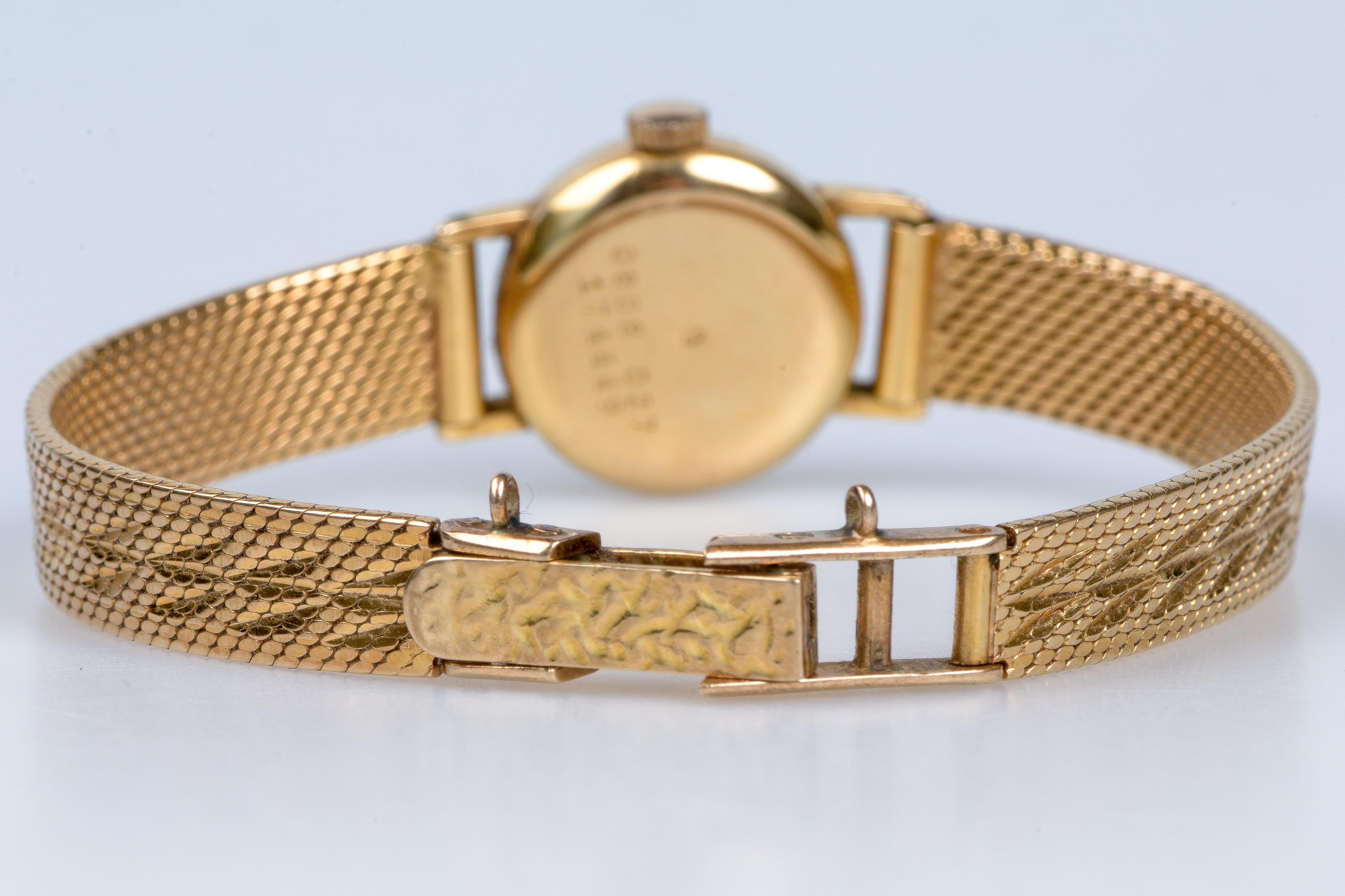 CERTINA's watch in 18carats yellow gold with a soft decorated fine mesh bracelet 6