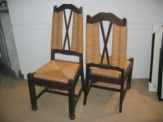 Cerused oak chairs with original rush seats attributed to Maxime Old. A pair made in the 1940s.