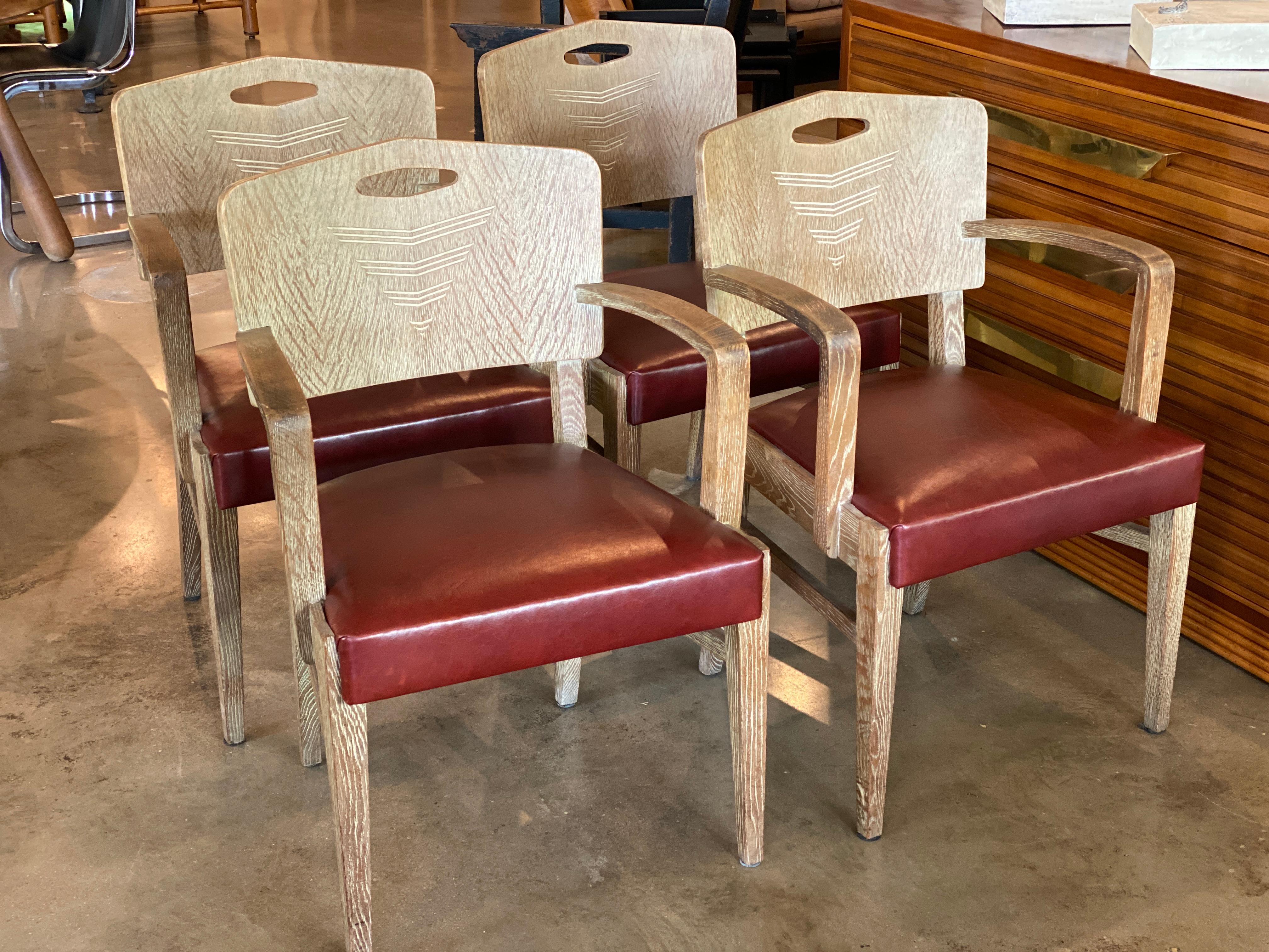 Set of four Art Deco oak chairs with cerused finish designed by famed Swiss architect Michel Polak. Newly upholstered seats in oxblood red/maroon leather. Likely an early fabrication by Joseph de Coene. Brussels, 1930-1935
Also sold as a pair see