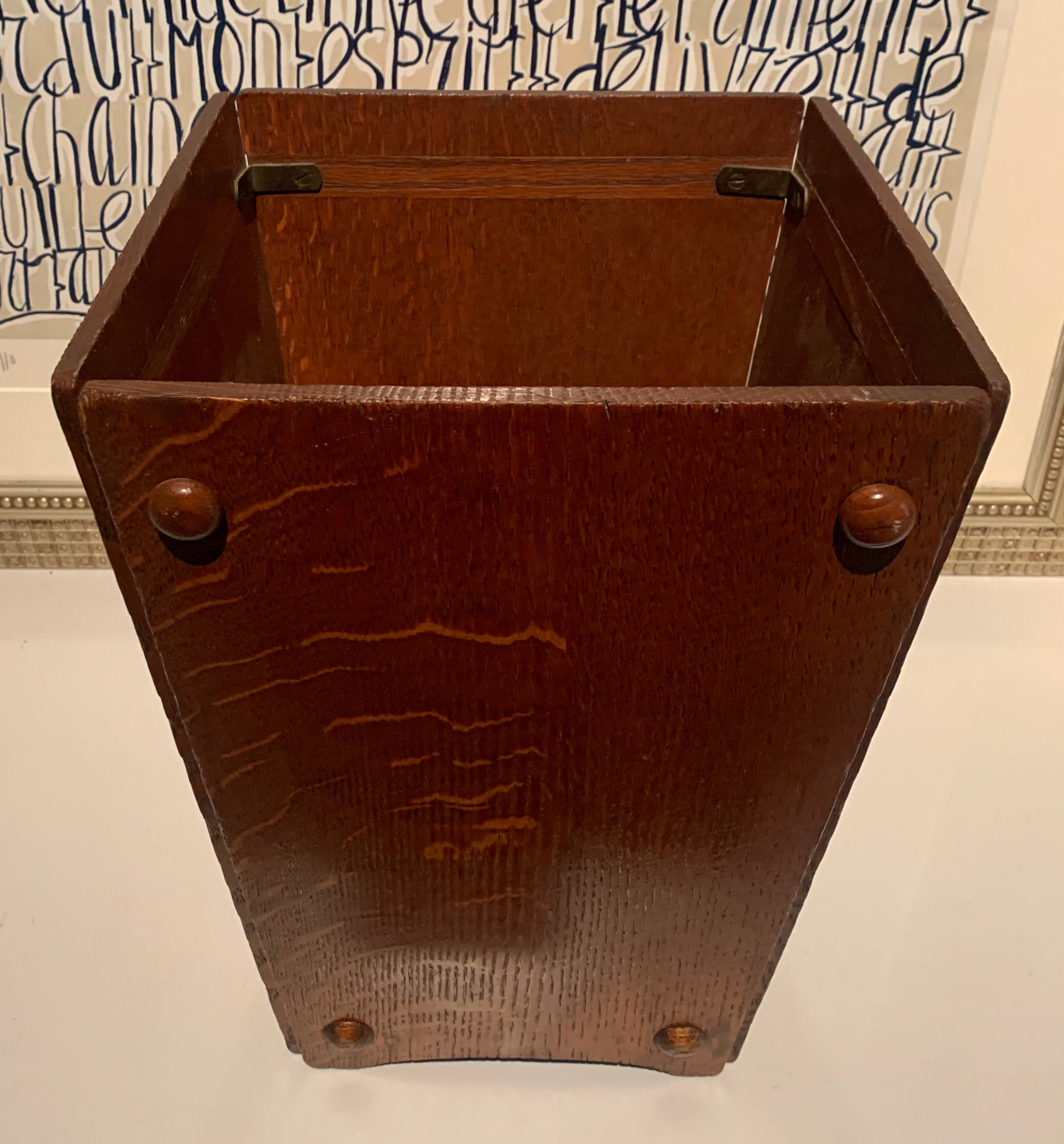 A sturdy and wonderfully aesthetic Arts & Crafts cerused oak waste can. The very simple panels of cerused Oak with a subtle arch at the base with four wooden pegs in each side give this piece a special architectural look that will compliment any