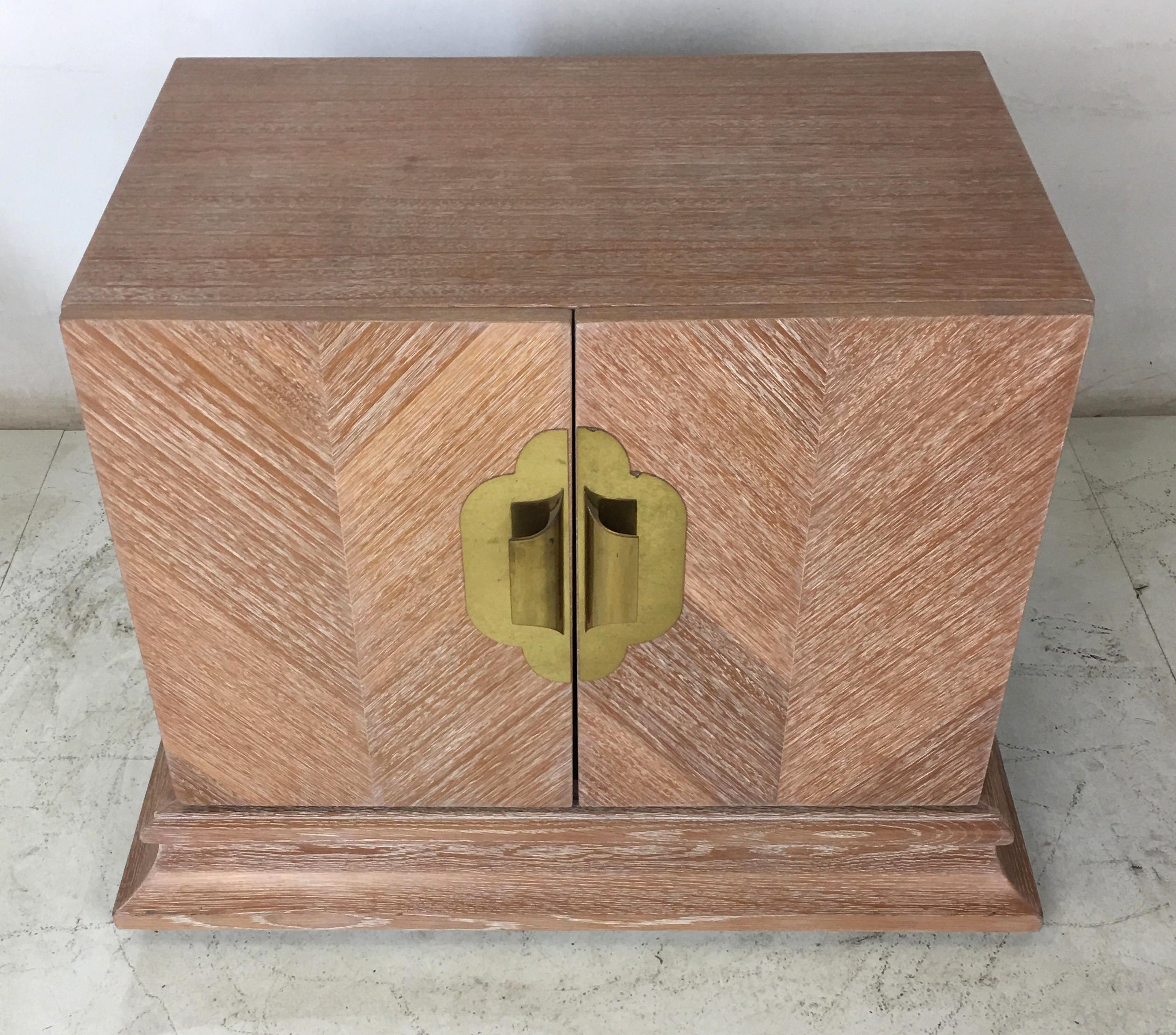 Handsome cerused oak nightstand or end table with chevron patterned Marquetry and polished brass hardware. The interior features a single shelf. Top quality materials and workmanship.