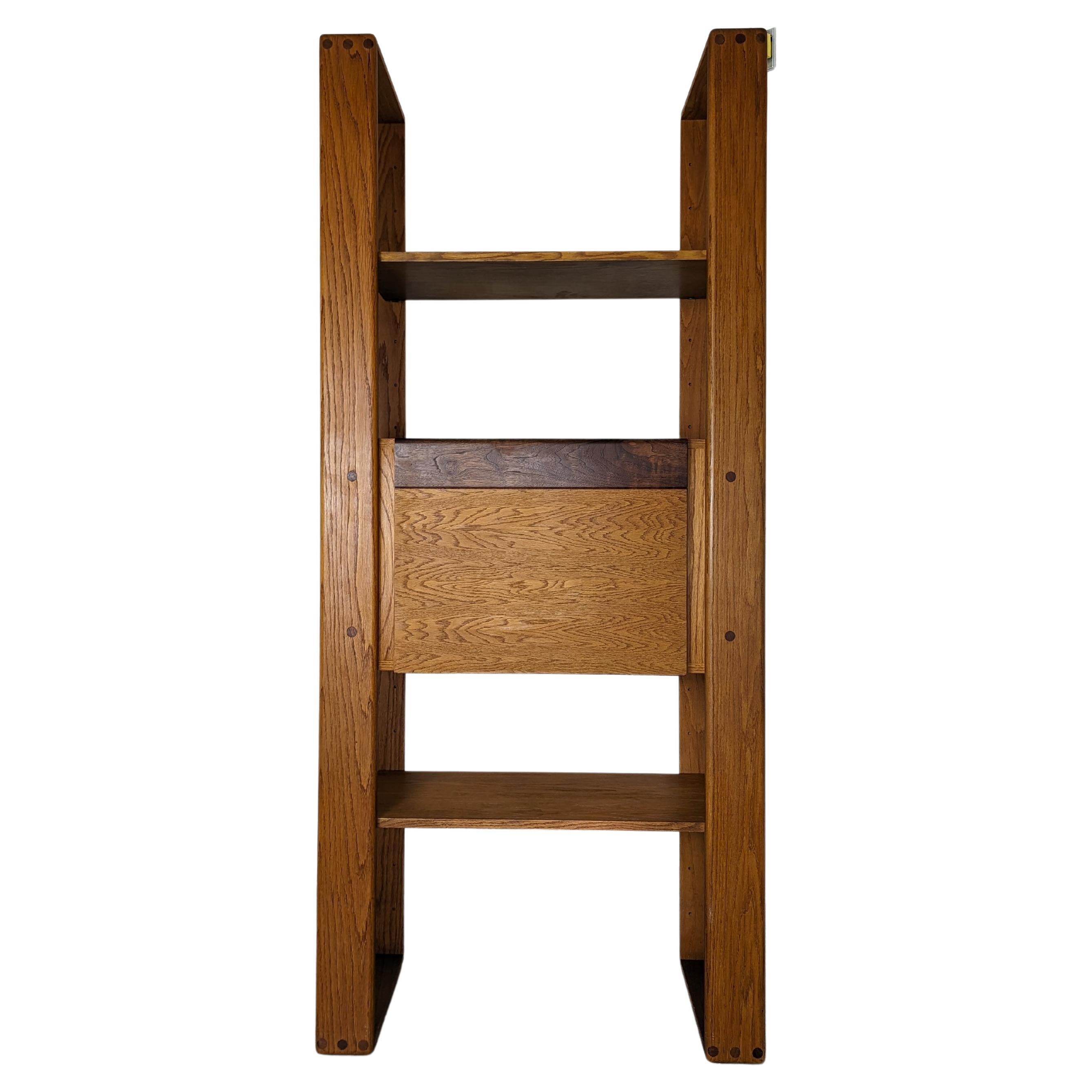 For sale is a genuine, mid-century modern marvel - a cerused oak modular standalone shelving unit, designed by the renowned Lou Hodges in 1979. This cherished piece comes straight from the creative minds of the California Design Group, known for