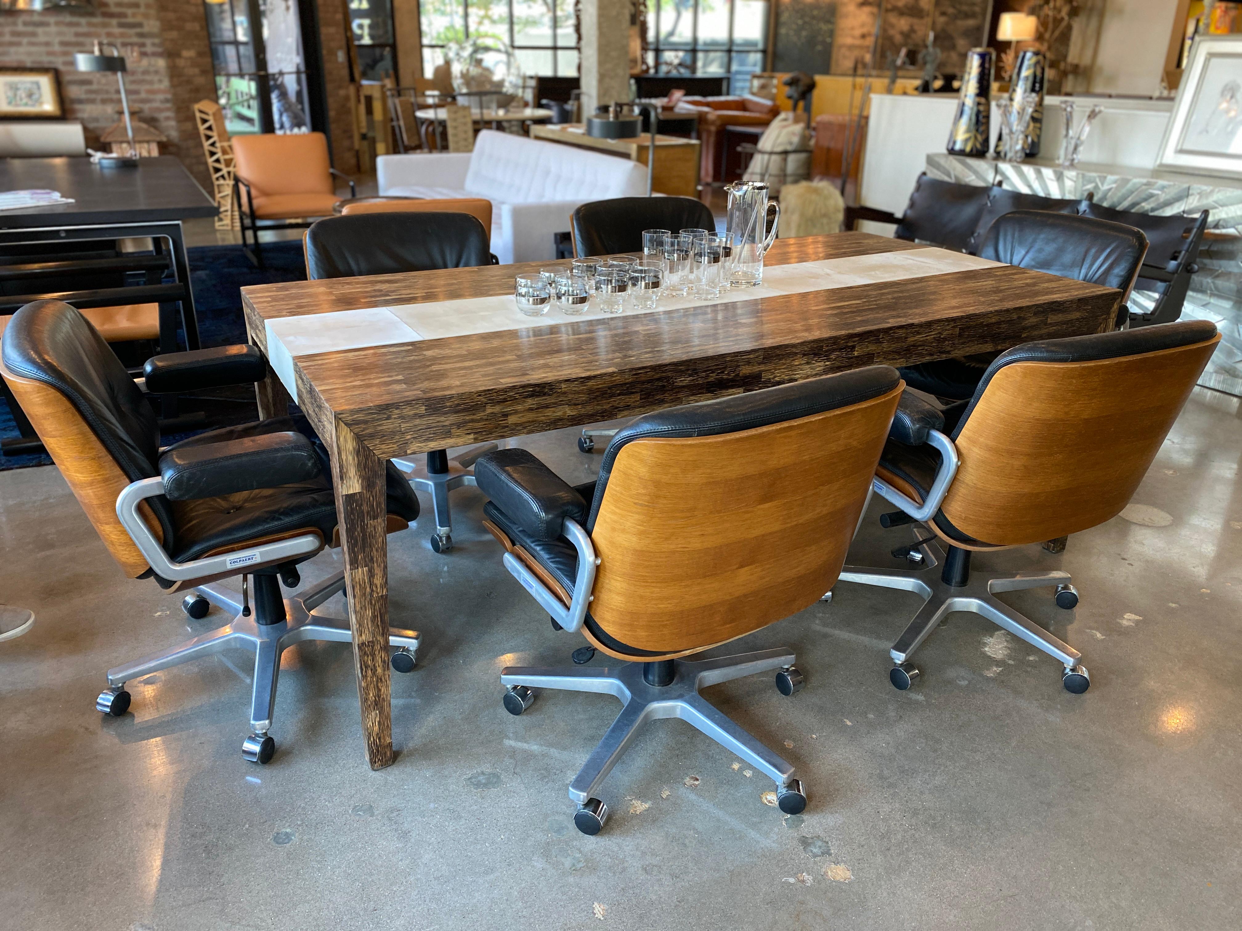 Cerused palmwood dining table or desk with goatskin parchment stripe down middle, by R & Y Augousti, French designers known for their use of exotic materials and art deco design aesthetic. 
 