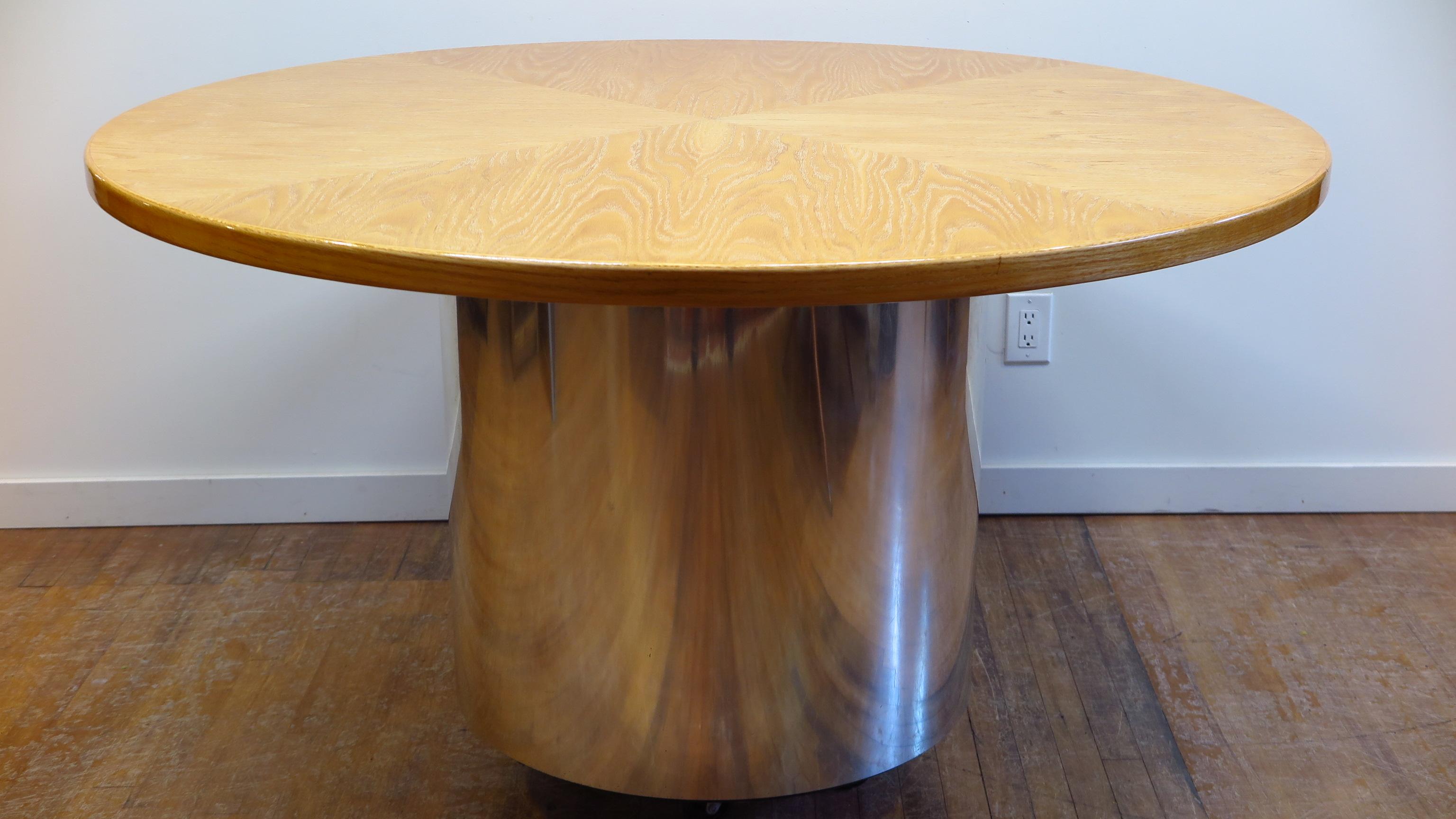 Custom built Gunderson round dining table cerused oak on chromed panel cylinder base, circa 1975 this item was a custom made one of a kind.   Light natural color top with a contrasting material base adds a very warm touch to a modern environment. 