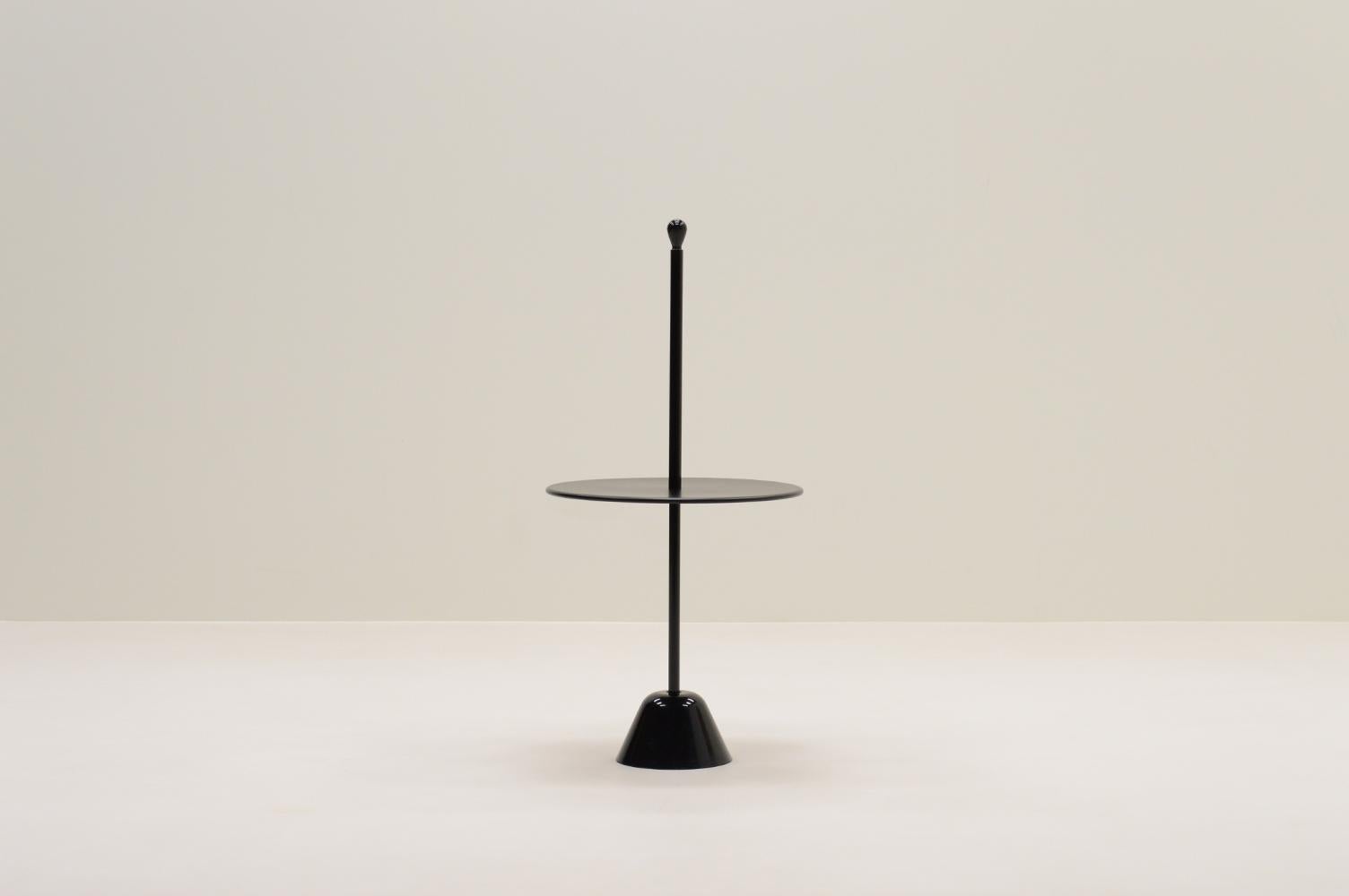 Cervomuto side table by Achille Castiglioni for Zanottta, 1970s Italy. A combination of a polypropylene base, steel column and wooden top, all finished in black. The Servomuto was designed for the Servi range by Achille Pier Giacomo Castiglioni in