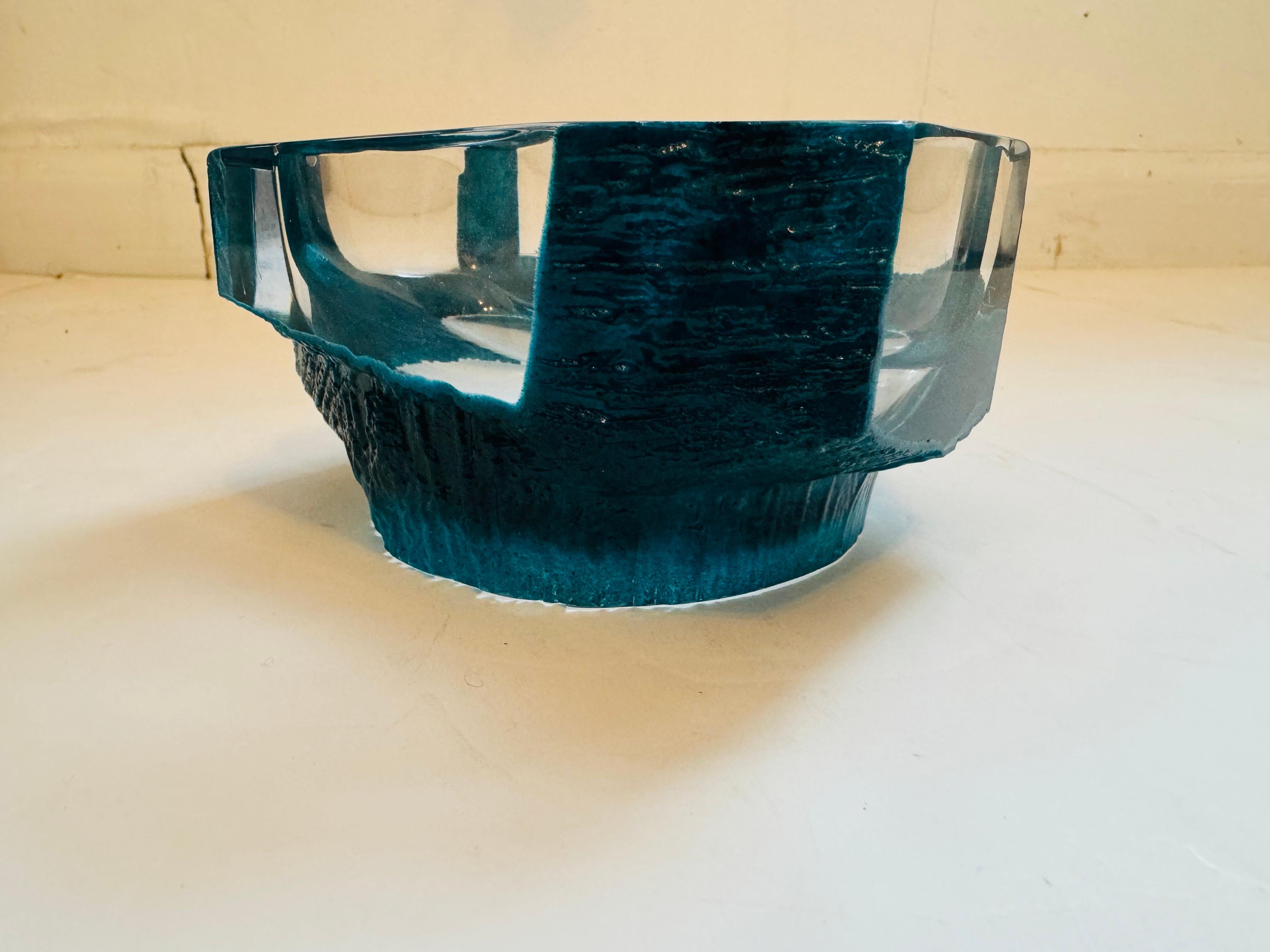 A rare French brutalist crystal bowl in blue green /turquoise coloring designed be famed French artist, Cesar Baldaccini for Daum.

Biography:
César was a French sculptor and member of the Nouveau Réalisme movement, best known for his use of