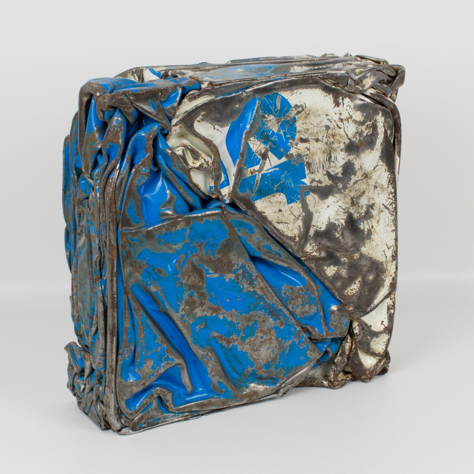 Stunning French abstract sculpture, featuring a compression of industrial metal elements. Eye-catching design with original paint in blue and white colors with raw metal detailing. Each face offers a versatile view of the artist's work. French