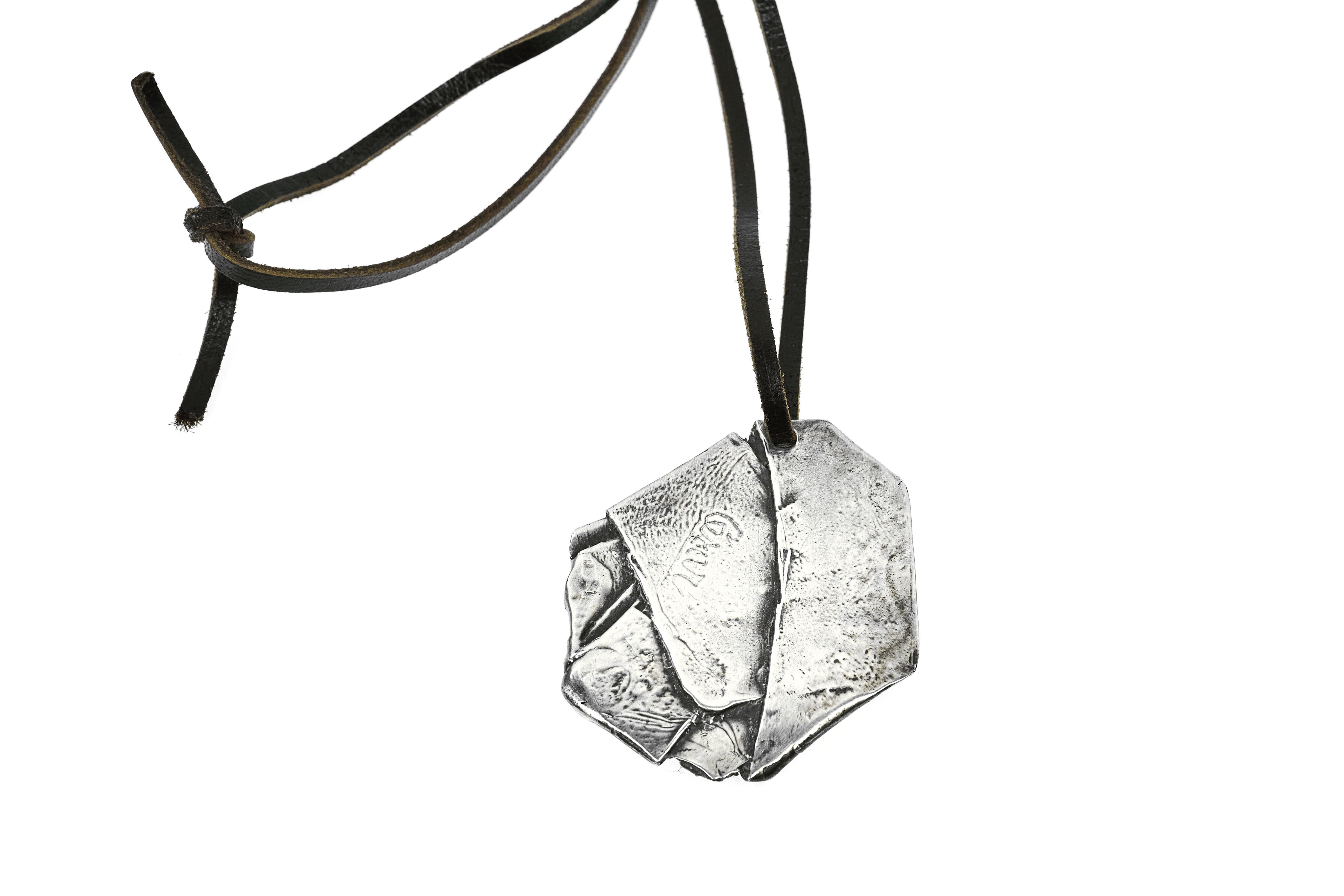 A fine and rare compression pendant by Cesar Baldaccini. Done in his signature style of compressing various metals, this particular piece is rare as it's been done in solid sterling silver. 

Signed on backside 'Cesar',

1975

Measures: 2.5