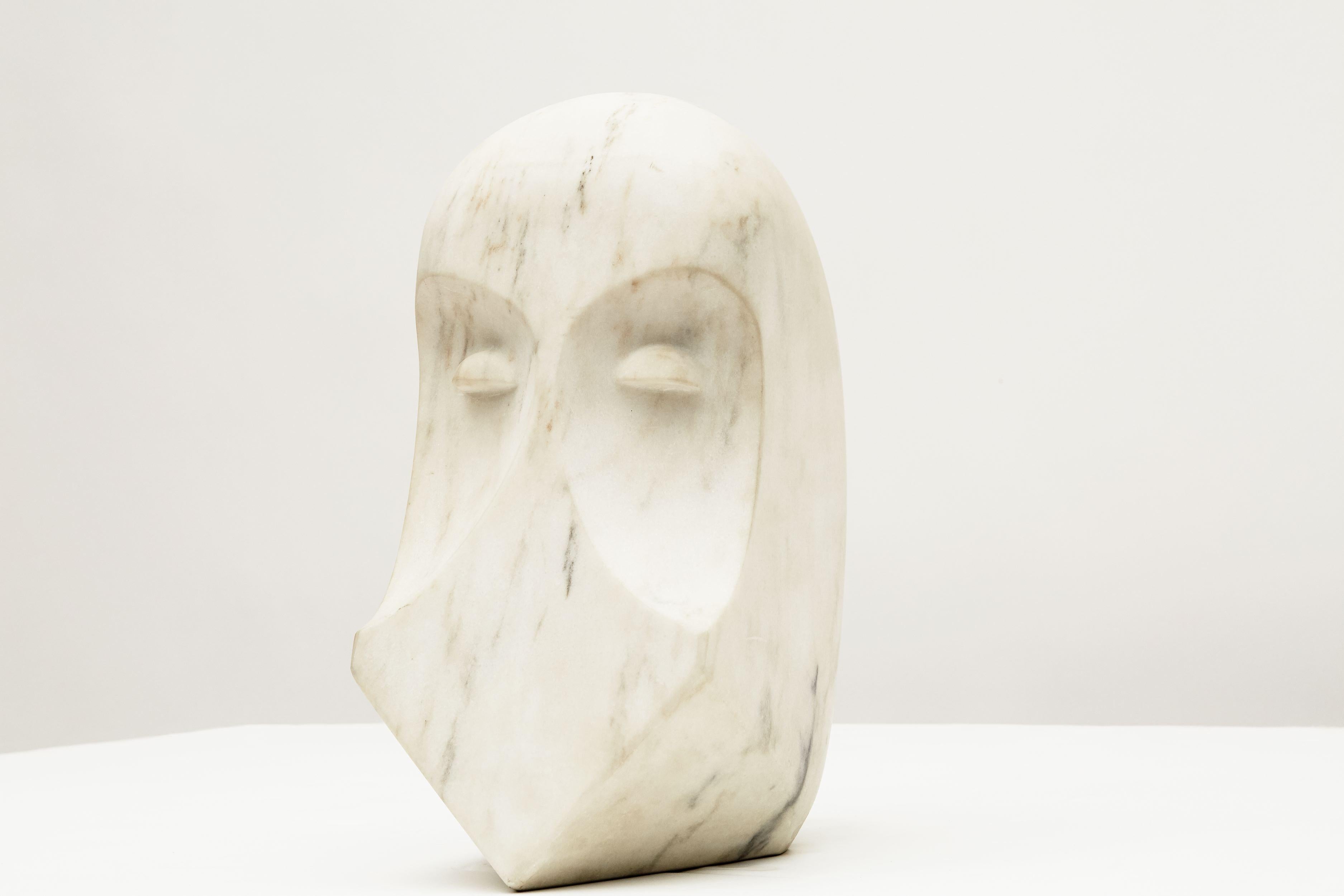 Inscribed: CLF 
Unique piece.

The simple mouthless face is cut cleanly into this smooth piece of white Alabama white marble--an intimation of the code after which the piece is named.
  