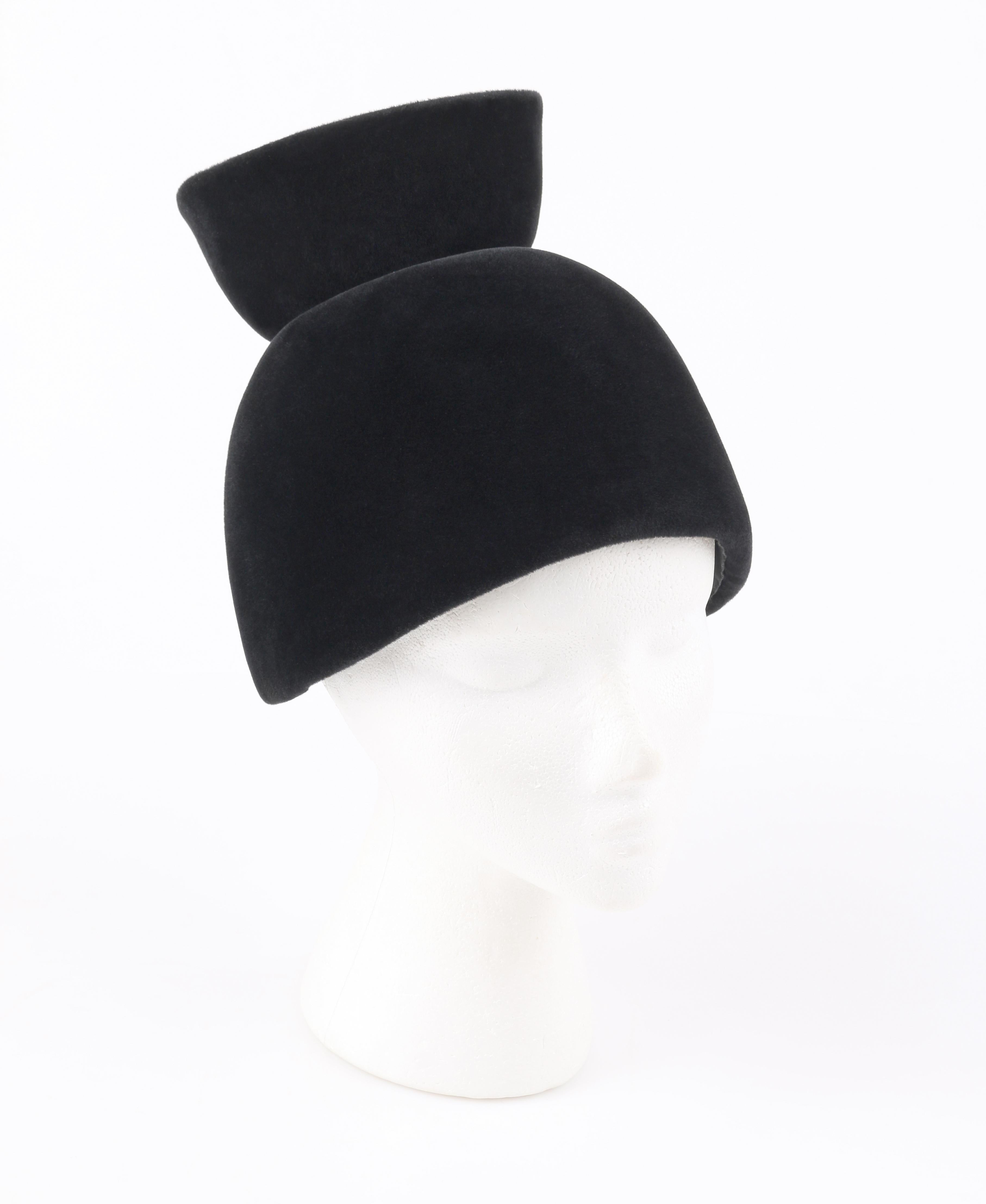 DESCRIPTION: CESARE CANESSA c.1950's Haute Couture Numbered Black Velvet Sculptural Hat 
 
Circa: c.1950’s
Label(s): Cesare Canessa Roma; Made In Italy Exclusively for Bonwit Teller
Style: Sculptural hat
Color(s): Black
Lined: Yes
Unmarked Fabric