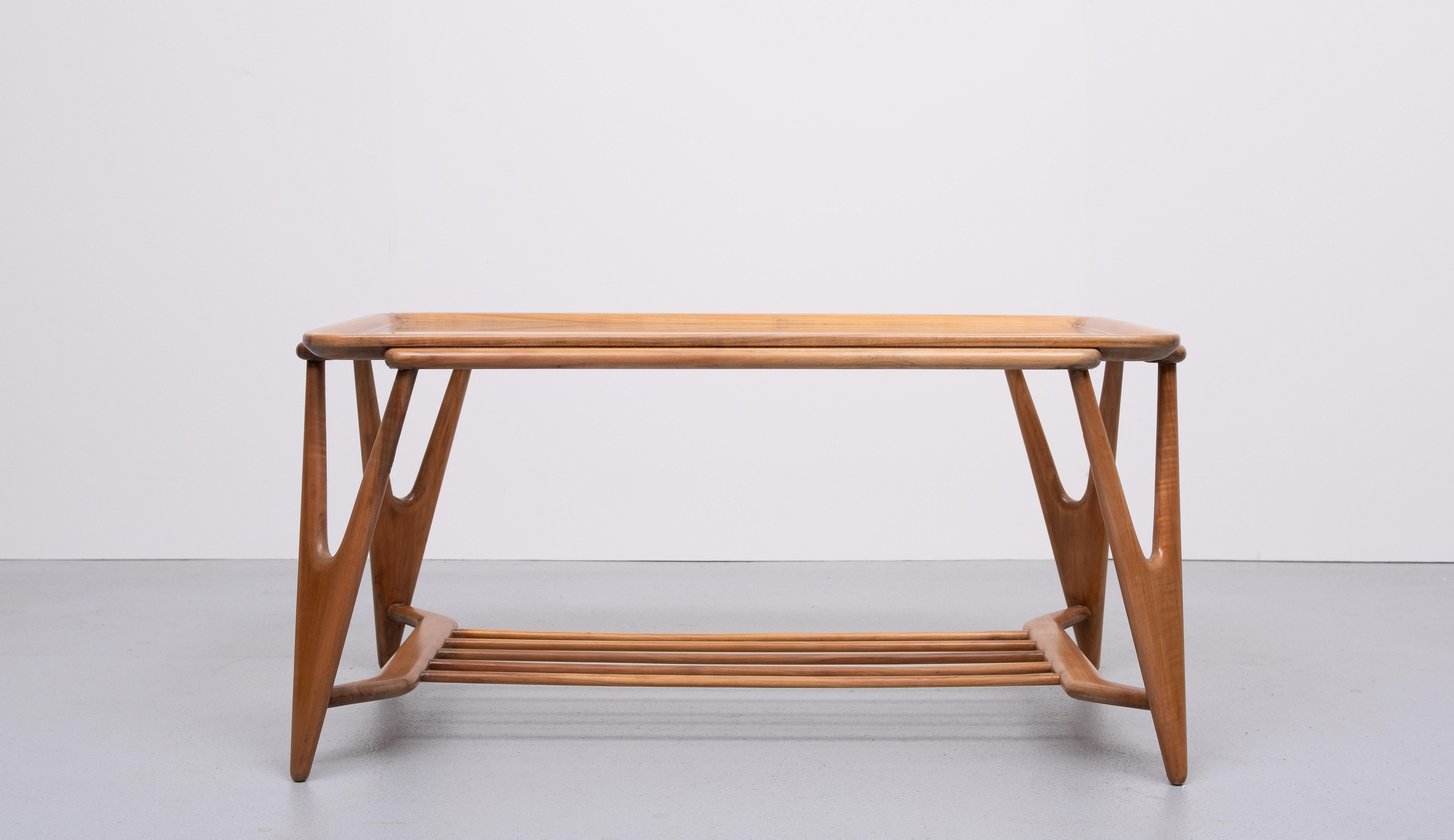 Very nice organic shaped coffee table . Solid Nutwood . 
Glass top . good condition . 