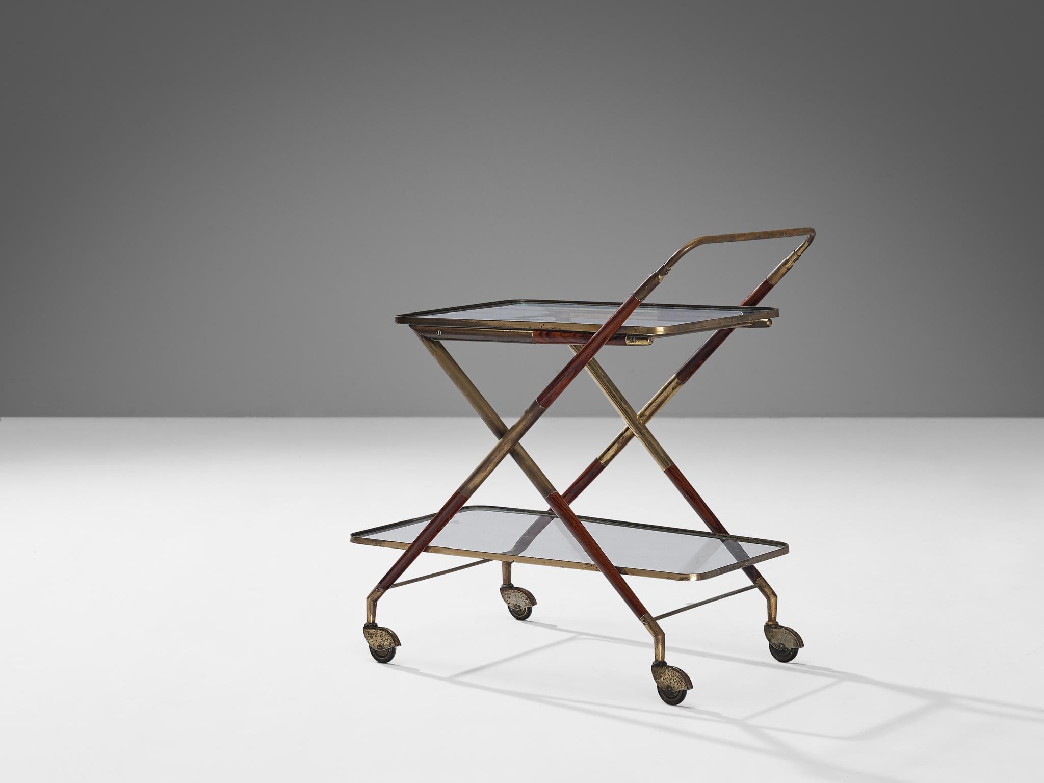Cesare Lacca, bar cart, wood, brass, glass, Italy, 1950s

Serving trolley or bar cart created by Italian designer Cesare Lacca. The whole construction of this serving trolley is based on clear lines and round edges. Two glass trays establish