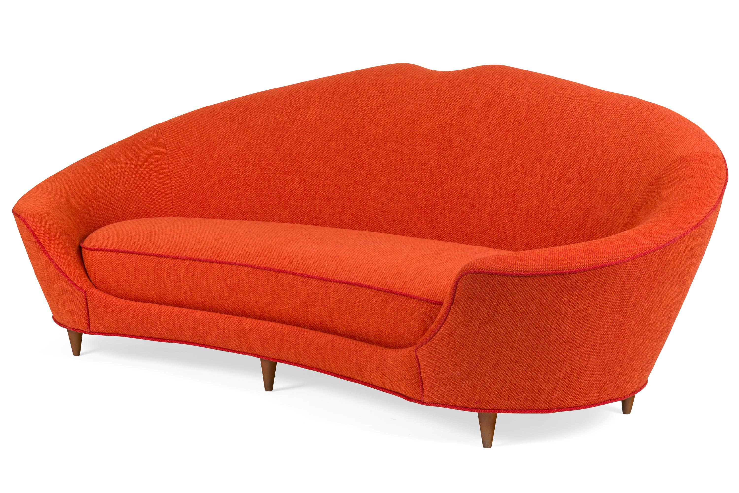 Cesare Lacca's sofas always have a distinctive dip in the center. Some are subtle as seen in this sofa and others are more emphasized as can be seen in his settees.