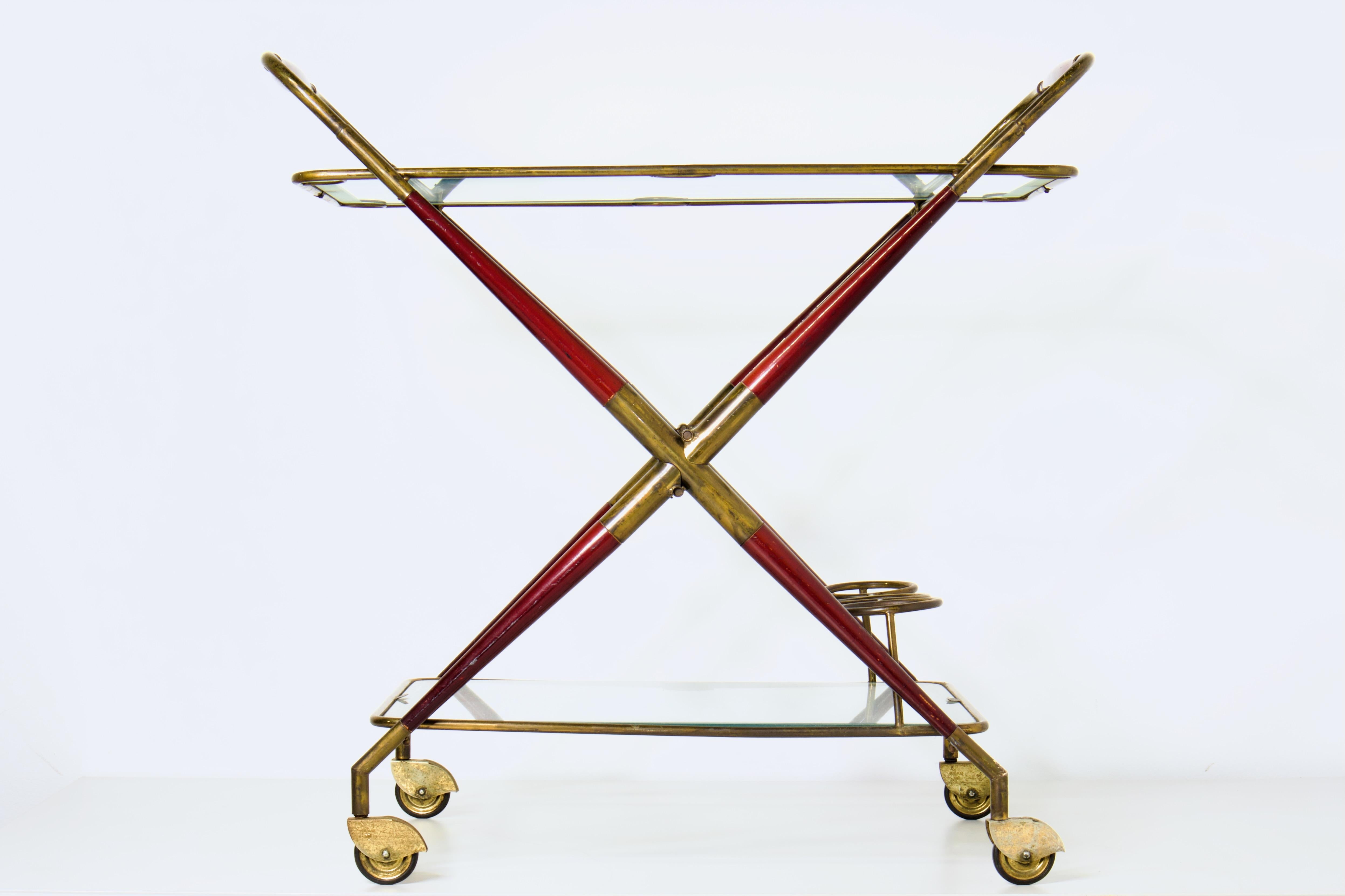 Exquisite Mid Century Modern Italian folding, rolling bar cart by Cesare Lacca. Made in the 1950s Italy, it evokes the same influences as other icons of the era: Gio Ponti, Ico Parisi and Gigi Radice.

This extraordinarily preserved set includes the