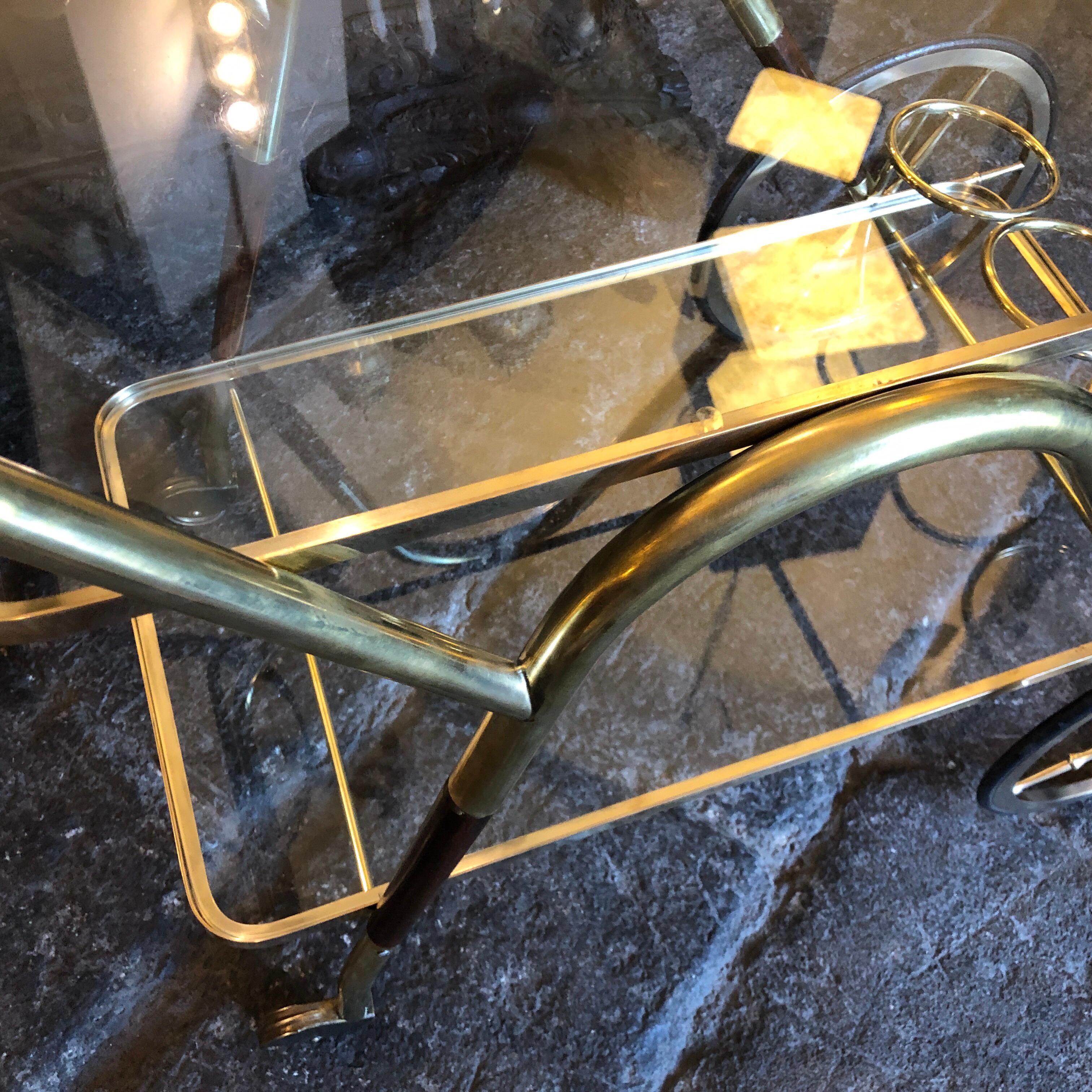 A bar cart designed by Cesare Lacca and manufactured in Italy in the Fifties in lovely conditions, brass has been cleaned, wood is in very good conditions.This 1950s Bar Cart is a vintage piece of furniture that reflects the style and sophistication