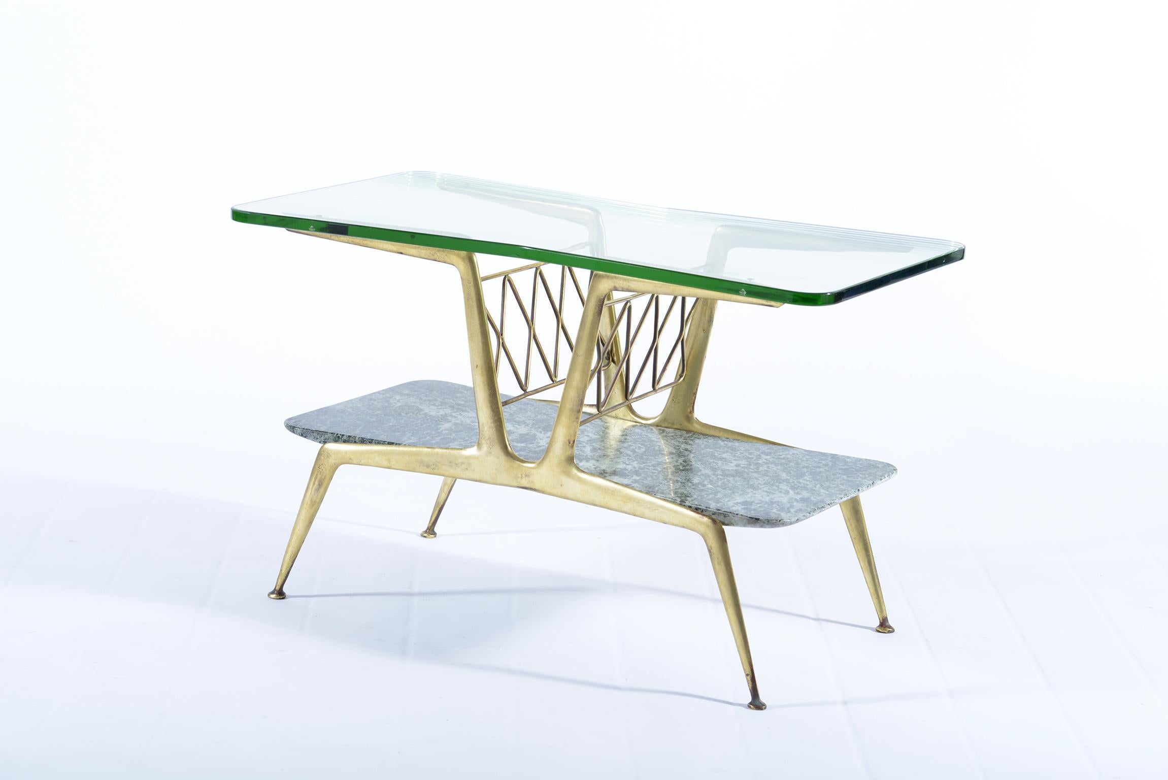 Midcentury brass cust structure with magazine rack space below marble alps worked with thicknesses of different height and double fan shape, in the upper part of ground glass of great thickness with rounded corners and double fans, this floor has