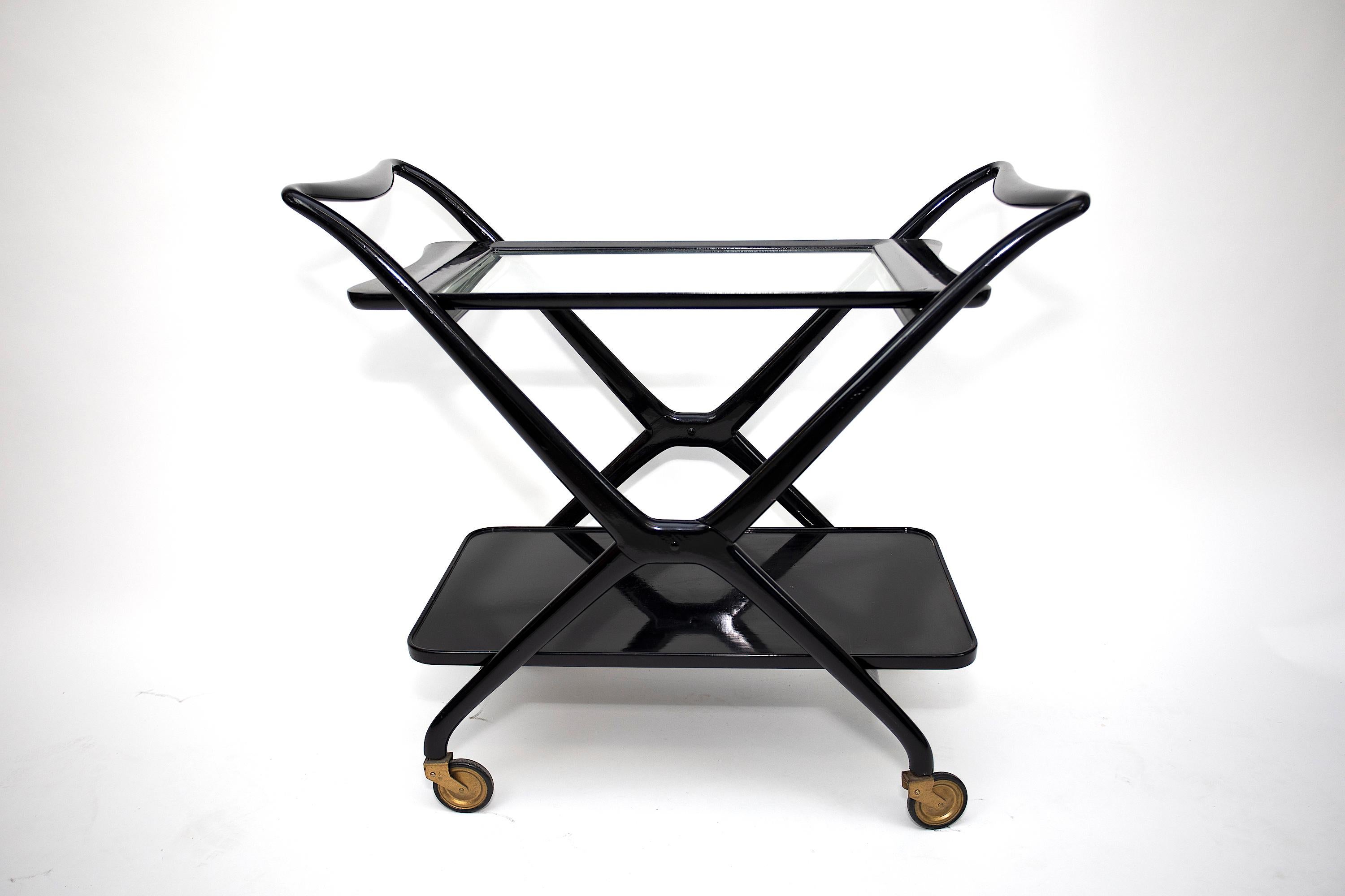 Cesarre Lacca serving cart
Original Dark Lacquer Finish
Both bottom shelf and top glass shelf is removable
Cart folds flat for storage
Stamped MADE IN ITALY.