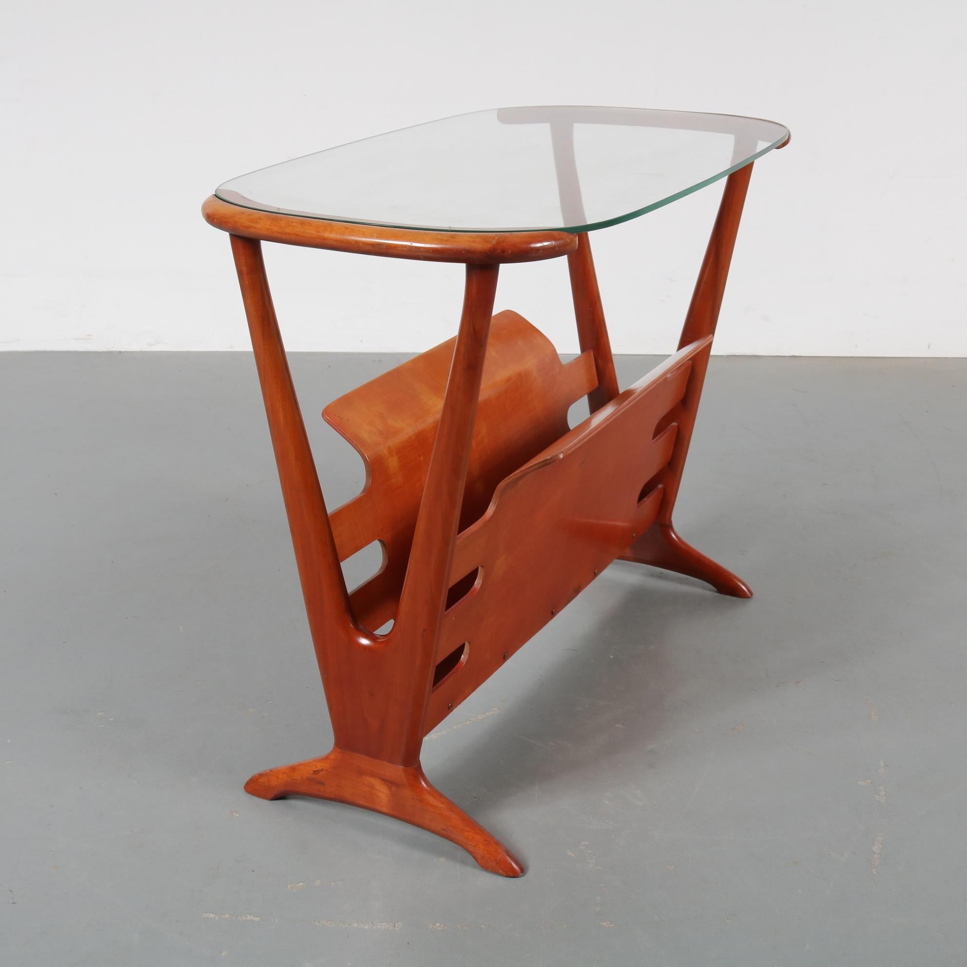 A beautiful side table in the style of Cesare Lacca, manufactured in Italy, circa 1950.

This amazing piece is made of high quality warm brown cherry wood and a clear glass top. It is beautifully crafted and has a very nice, organic shape giving