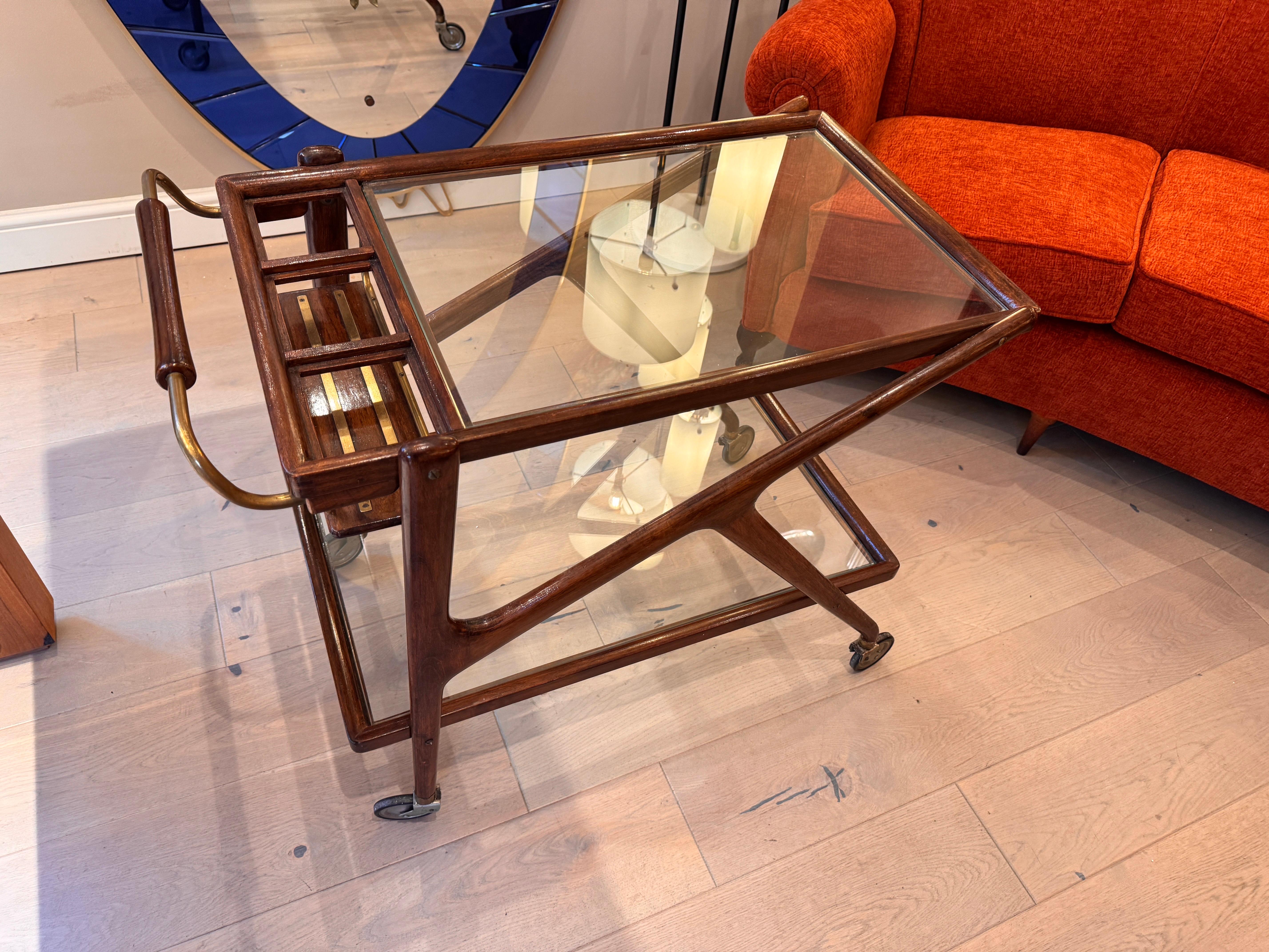 Cesare Lacca walnut bar cart with brass hardware and two glass shelves C1950s Italy 