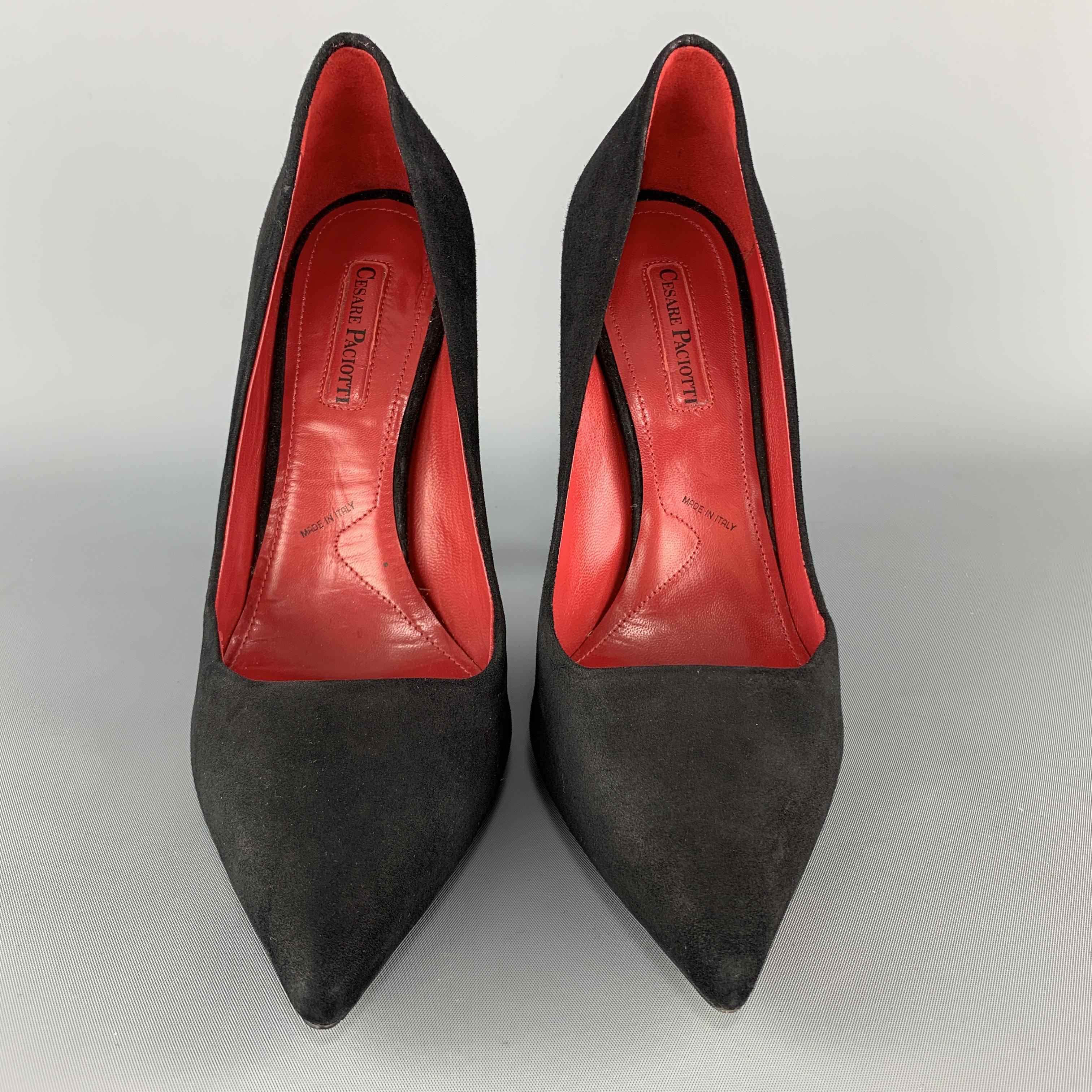 CESARE PACIOTTI pumps come in black suede with a pointed toe and silver tone sword detailed back. Made in Italy.

New without Tags.
Marked: IT 39

Heel: 5 in. 