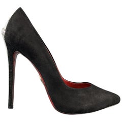 CESARE PACIOTTI pumps come in black suede with a pointed toe and silver tone swo