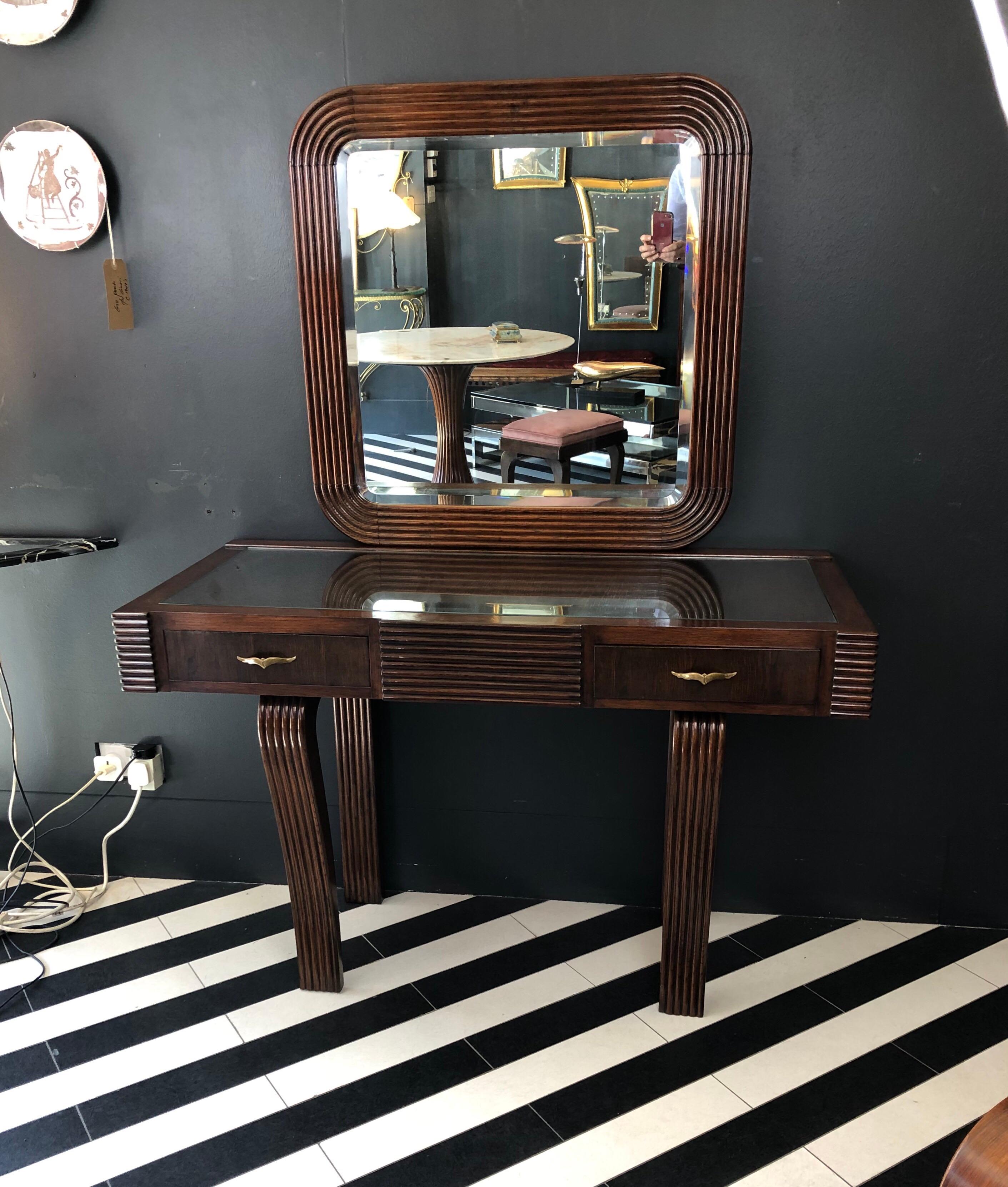 A rare and fantastic Art Deco bedroom set consisting of a dressing table with mirror ,stool and 2 matching chairs by the Italian architect Cesare Scocimarro. It has been totally restored and is constructed in wood with reeded detailing,a glass top
