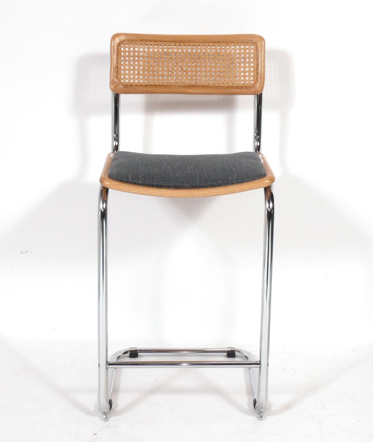 Set of three Cesca Model bar stools, in the manner of Marcel Breuer, probably Italian, circa 1980s. The seats are currently being upholstered and can be completed in your fabric. Simply send us 2.5 yards total of your fabric after purchase.