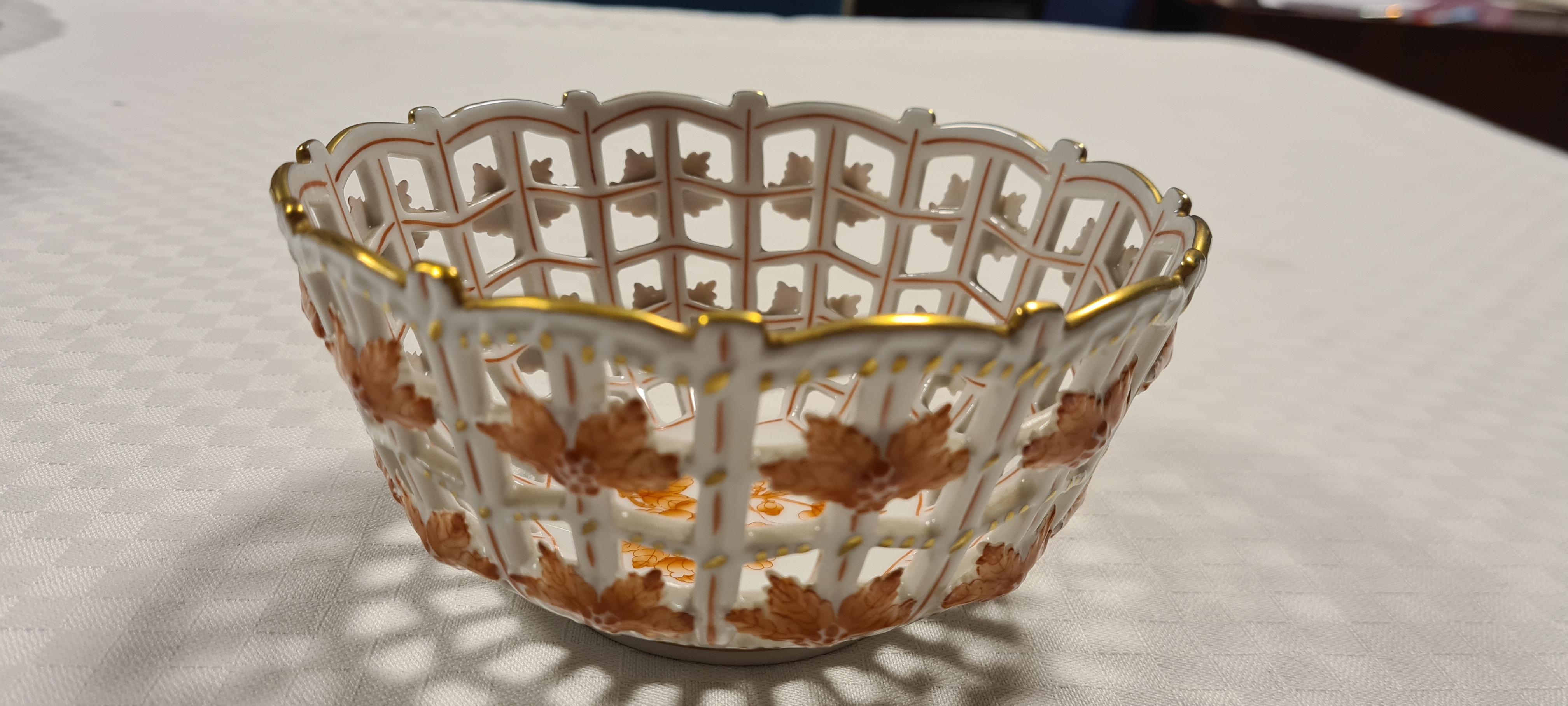 Porcelain potpourri basket by Herend Hungary.

Fine and rare basket made of the finest porcelain and hand-painted with enamel and 24-karat gold details.

Made by the leading Hungarian manufacturer Herend.

Part of the Apponyi collection in the