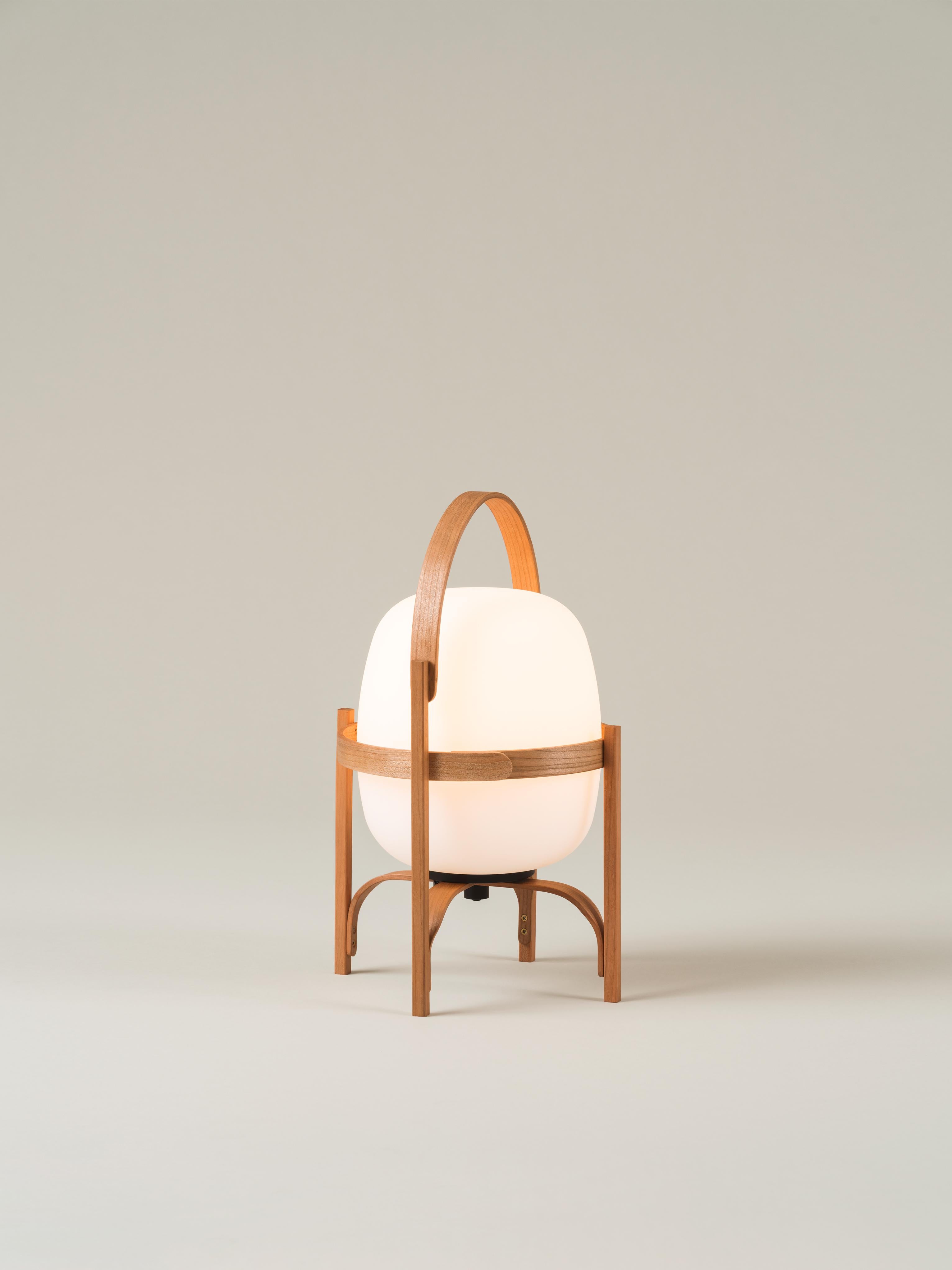 Cestita batería table lamp by Miguel Milá
Dimensions: D 22 x H 36 cm
Materials: Cherry wood, glass.
Available in polyethylene and glass shade.

A cordless, portable version, Cestita Batería is a lantern that creates an ambience of pleasure