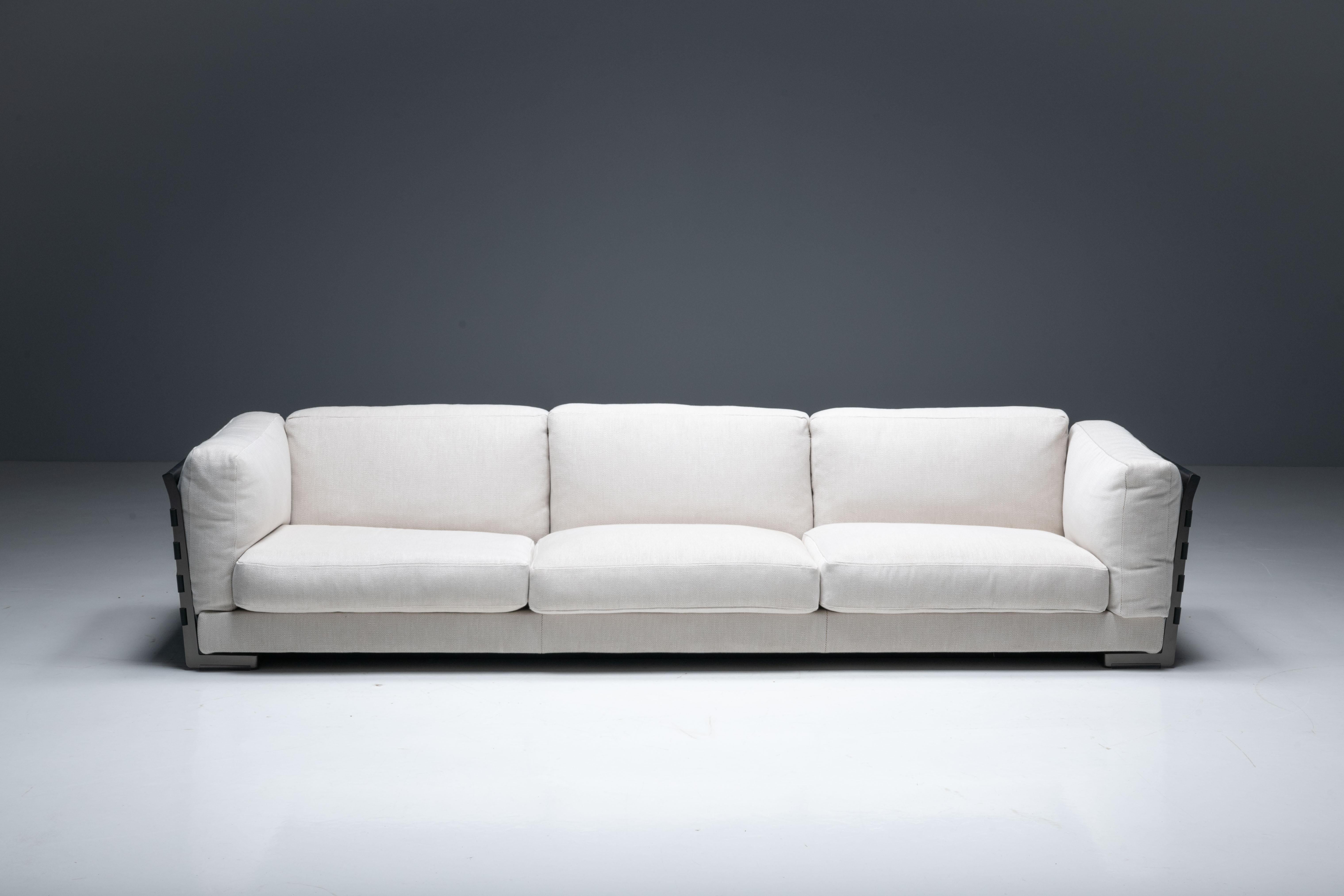 Cestone three-seater sofa designed in 2008 by Antonio Citterio for Flexform, an embodiment of authentic Italian craftsmanship. This showroom model, designed to command attention and take center stage in your living space, redefines the boundaries of