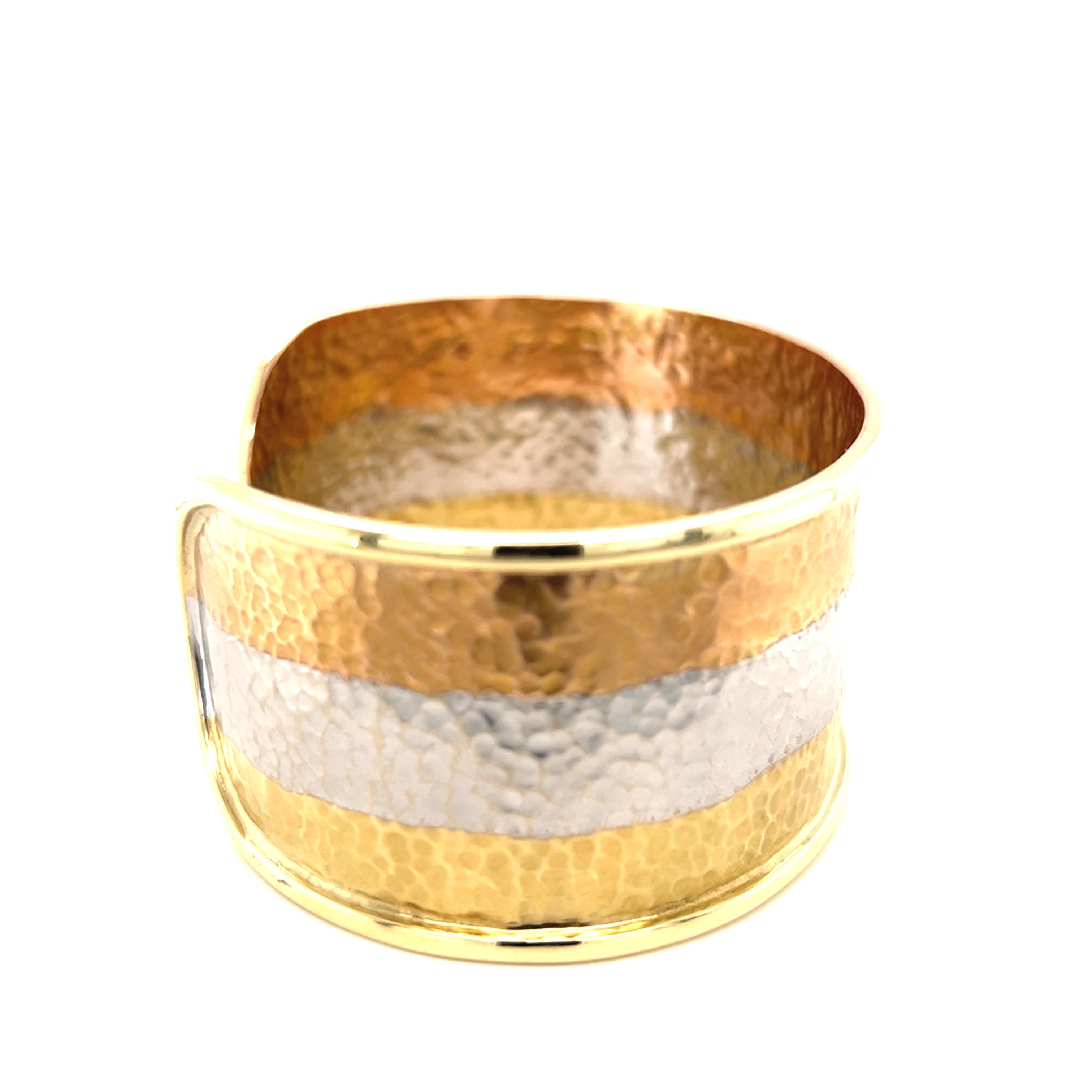 One 14-karat yellow, white, and rose hammered gold 34mm wide cuff bracelet designed by Cetas, stamped 