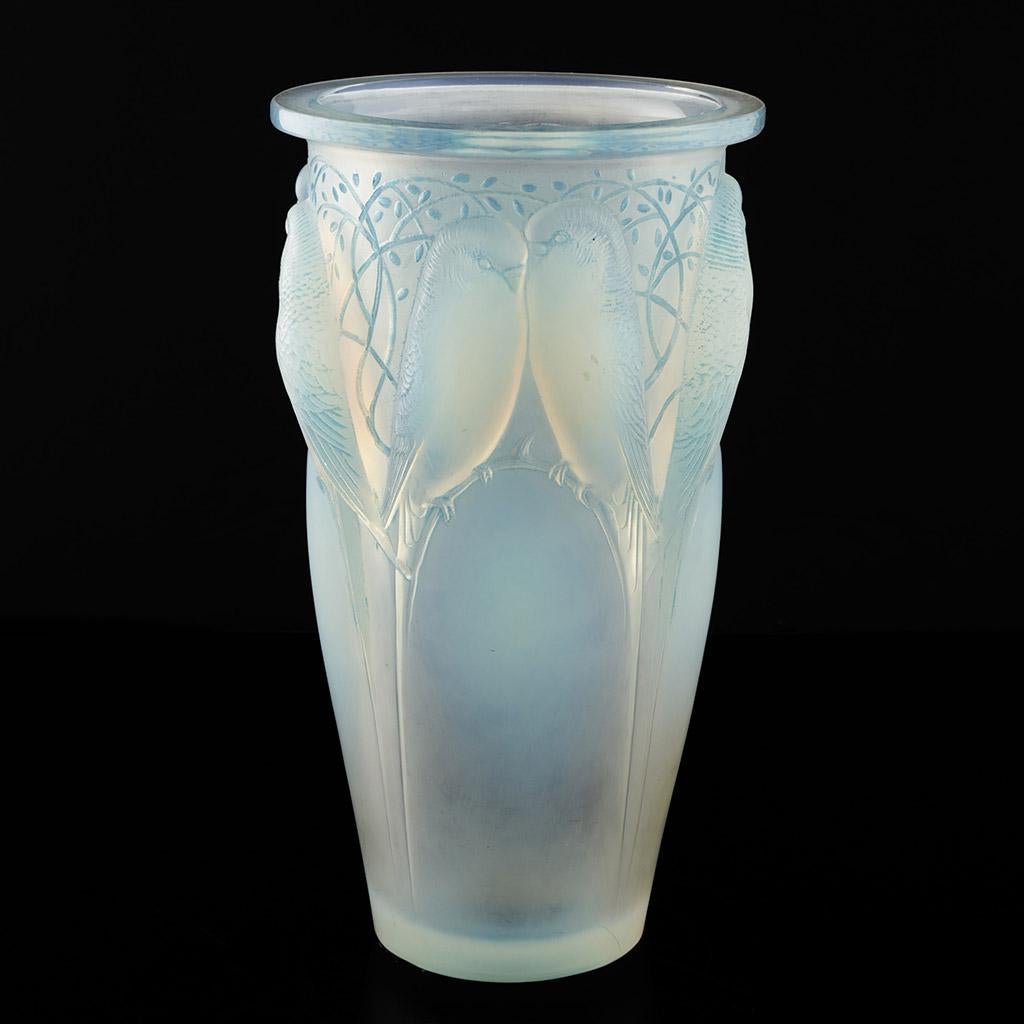 Ceylan, a frosted and opalescent glass vase. Hand etched R Lalique underside. Fine original condition with excellent opalescence. Love birds perched on blue opalescent branches.

René Jules Lalique (French, 1860–1945) was a renowned jeweller and