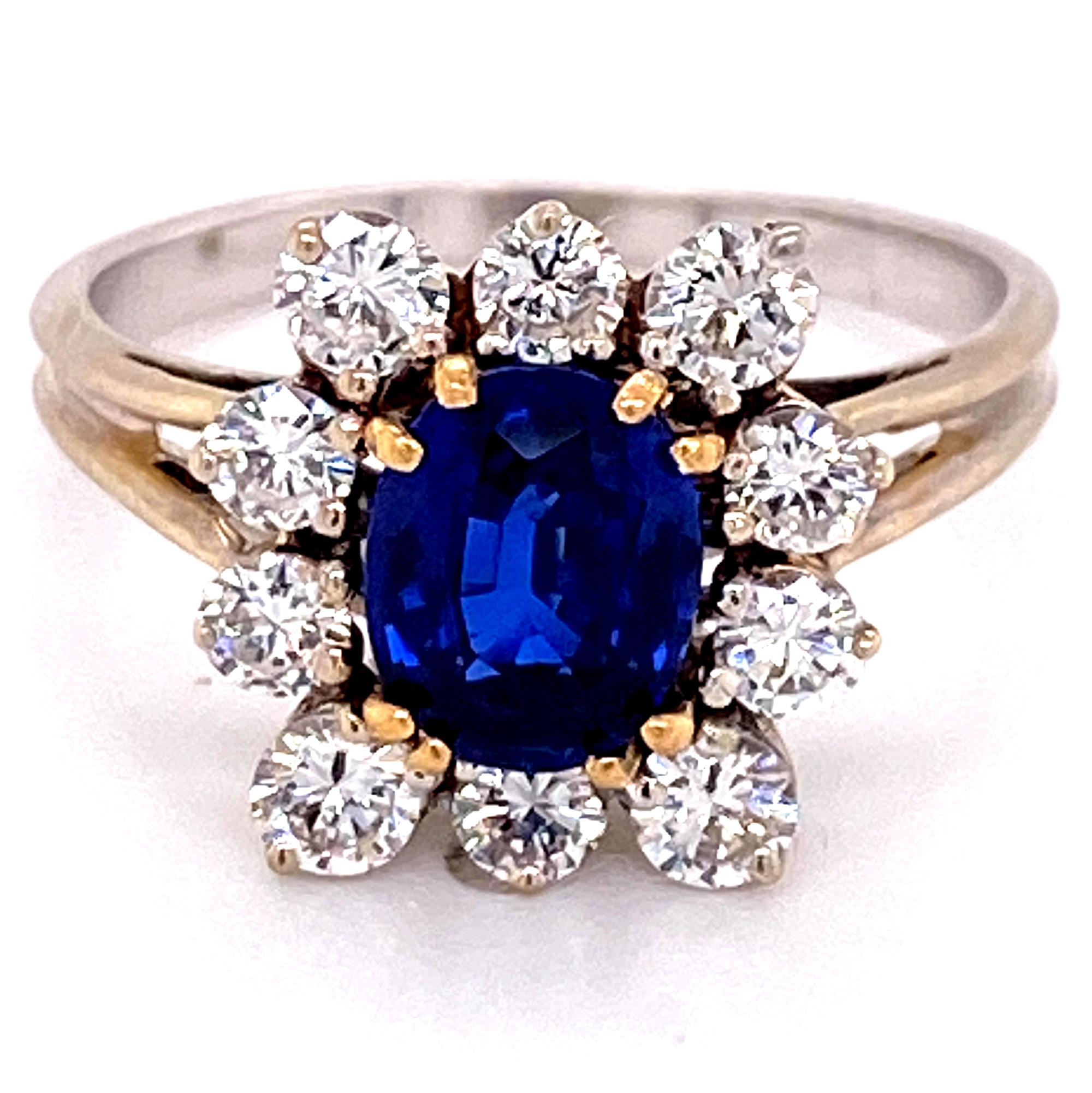 Gorgeous natural blue Ceylon sapphire diamond ring. The Ceylon oval cut sapphire weighs 1.29 carats and has an AGL certificate-see photos. The sapphire is surrounded by 10 round brilliant cut diamonds weighing 1.00 carat total weight and graded F