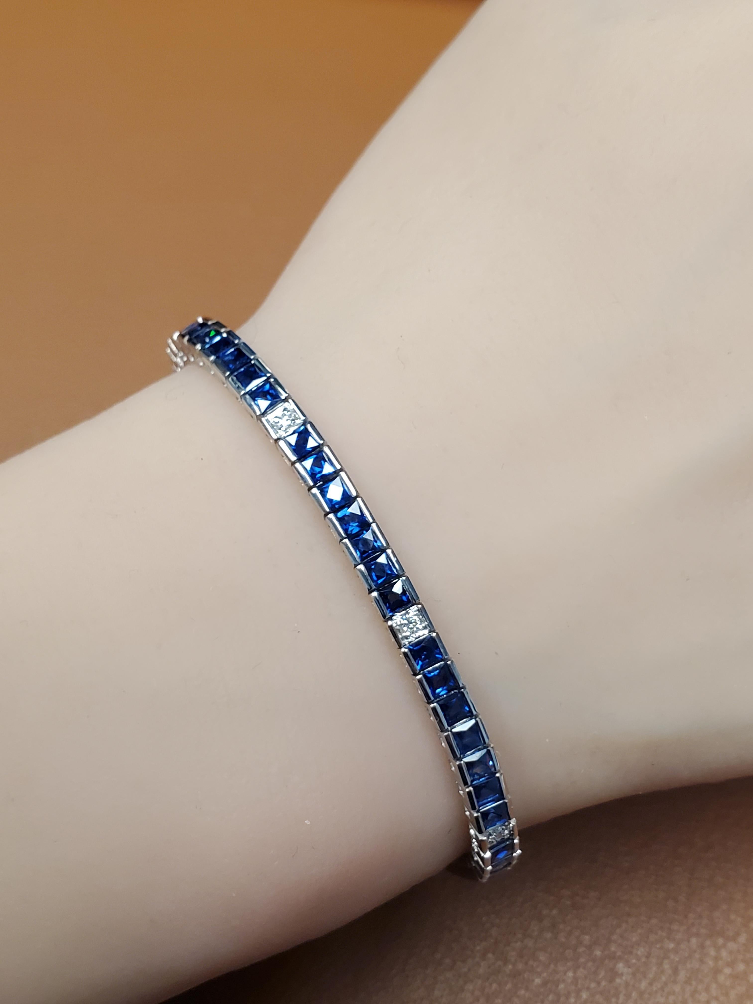Listed is this 18k white gold natural Ceylon blue sapphire and diamond bracelet. This bracelet features white vs diamonds surrounded by Peruzzi cut blue sapphires. 7