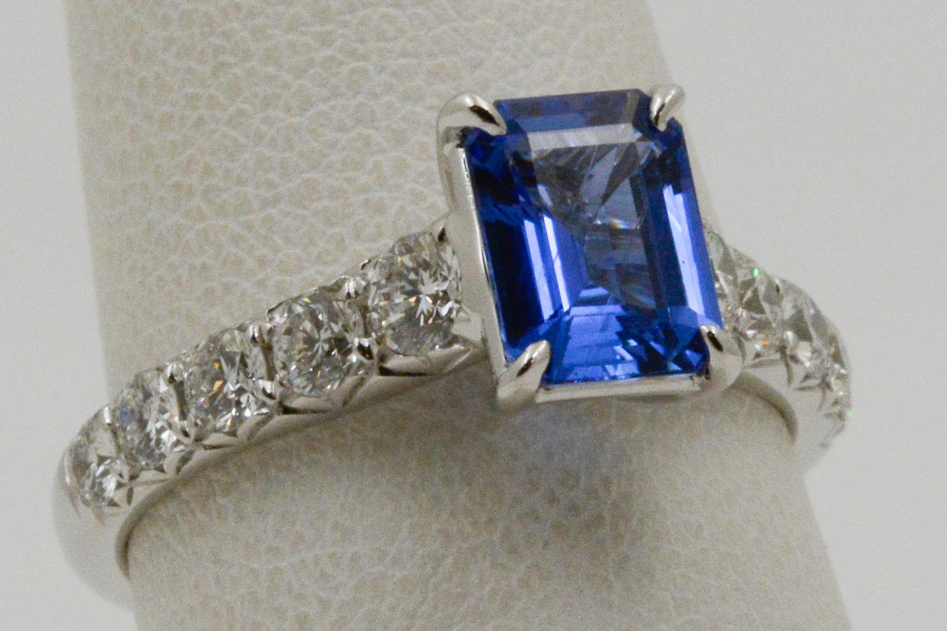 This 18 karat white gold Point of Love ring features a Ceylon blue sapphire weighing 1.57 carats. The ring also showcases 10 round brilliant cut diamonds weighing 0.76 carats. 