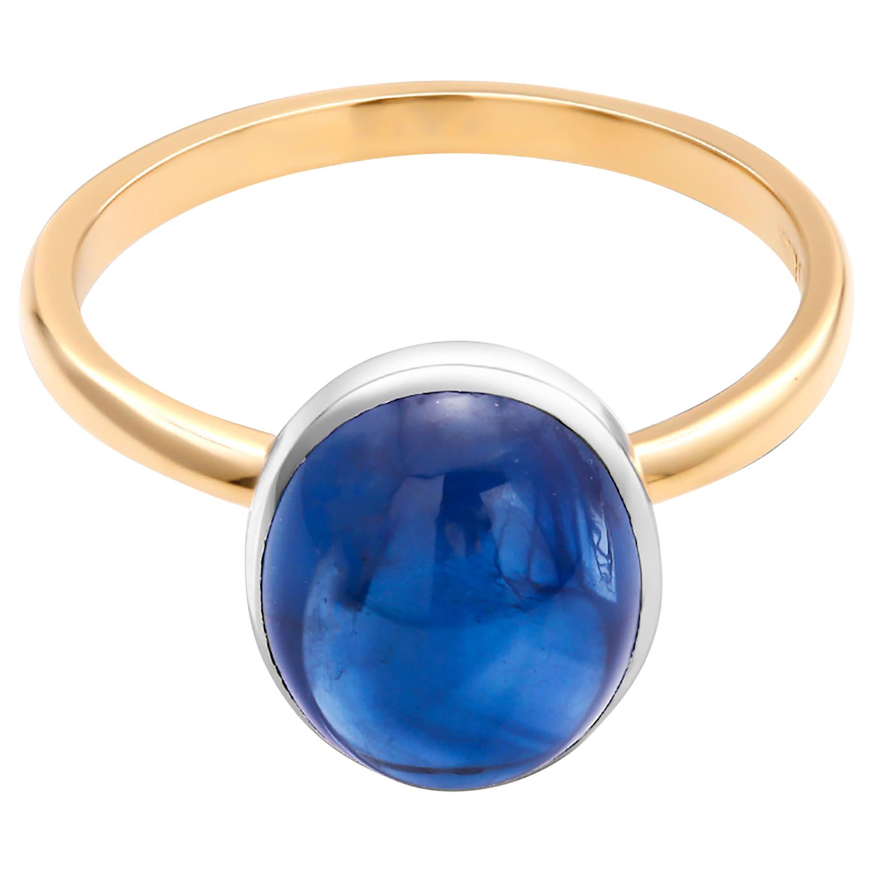 Eighteen karat white and yellow gold cocktail ring
Ceylon cabochon sapphire weighing  4 carat                                                                       
Ring size 6 In Stock
Ring can be resized 
New Ring
Handmade in USA
Our design team