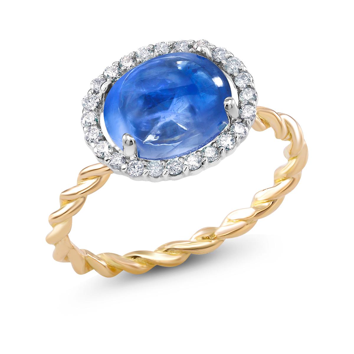 Fourteen karat rose and white gold braided ring
Ceylon cabochon sapphire weighing  3.32 carat                                                                       
Pave set diamond weighing 0.25 carat 
Ring size 6 In Stock
Ring can be resized 
New