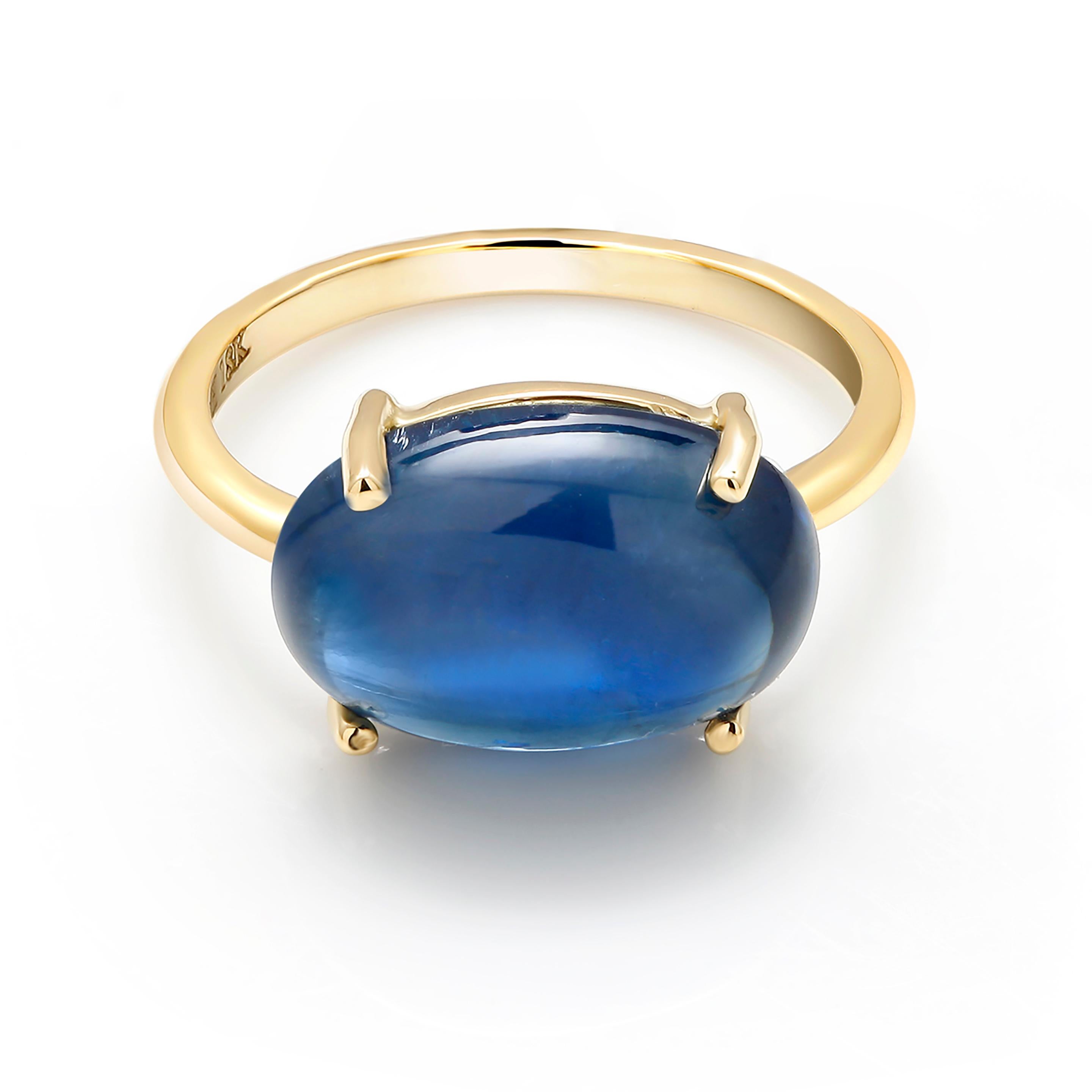 Eighteen karat yellow gold cocktail ring
Ceylon cabochon sapphire weighing  9.16 carat  
Sapphire measures 14x12 millimeter                                                                      
Ring size 5 In Stock
Ring can be resized 
New
