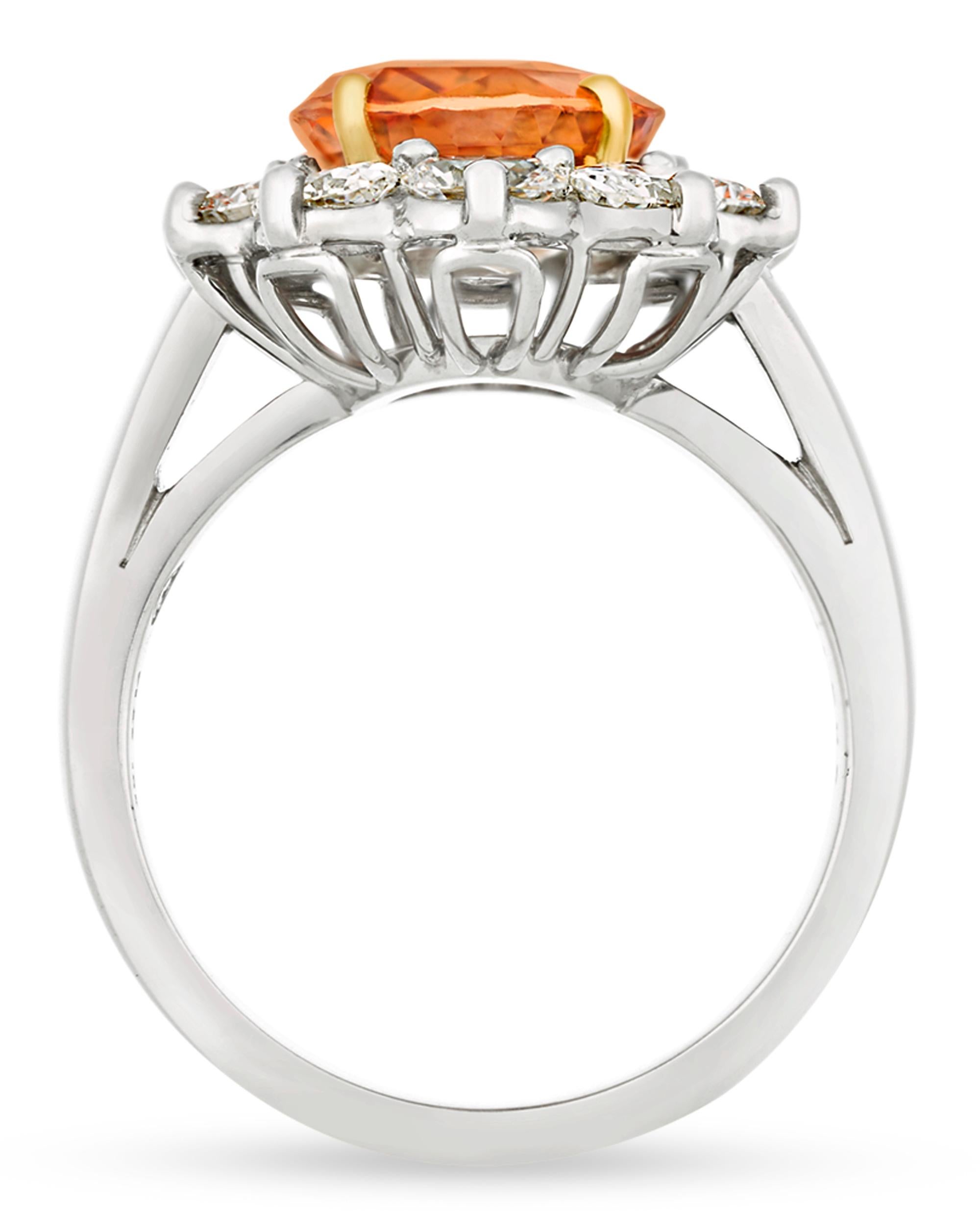 This classic ring by Oscar Heyman features a fancy orange Ceylon sapphire, one of the rarest of all fancy colored sapphires. Weighing 4.38 carats, the oval mixed-cut jewel displays a superb orange hue and is certified by C. Dunaigre as Ceylon in