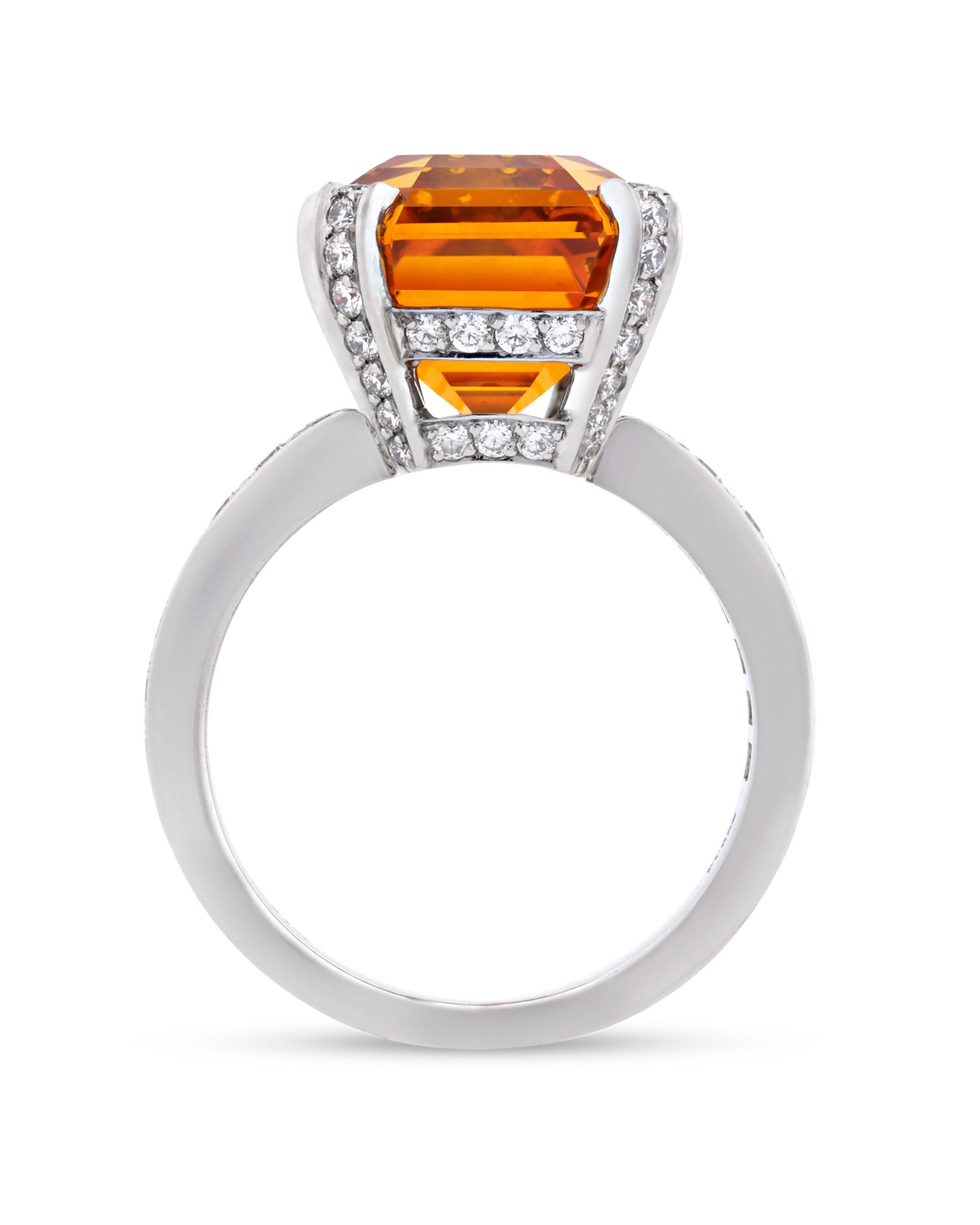 Created by Tiffany & Co., this classic ring features a fancy yellow-orange Ceylon sapphire, one of the rarest of all fancy colored sapphires. Weighing 11.75 carats, this rectangular emerald-cut jewel displays a superb orange hue and is certified by