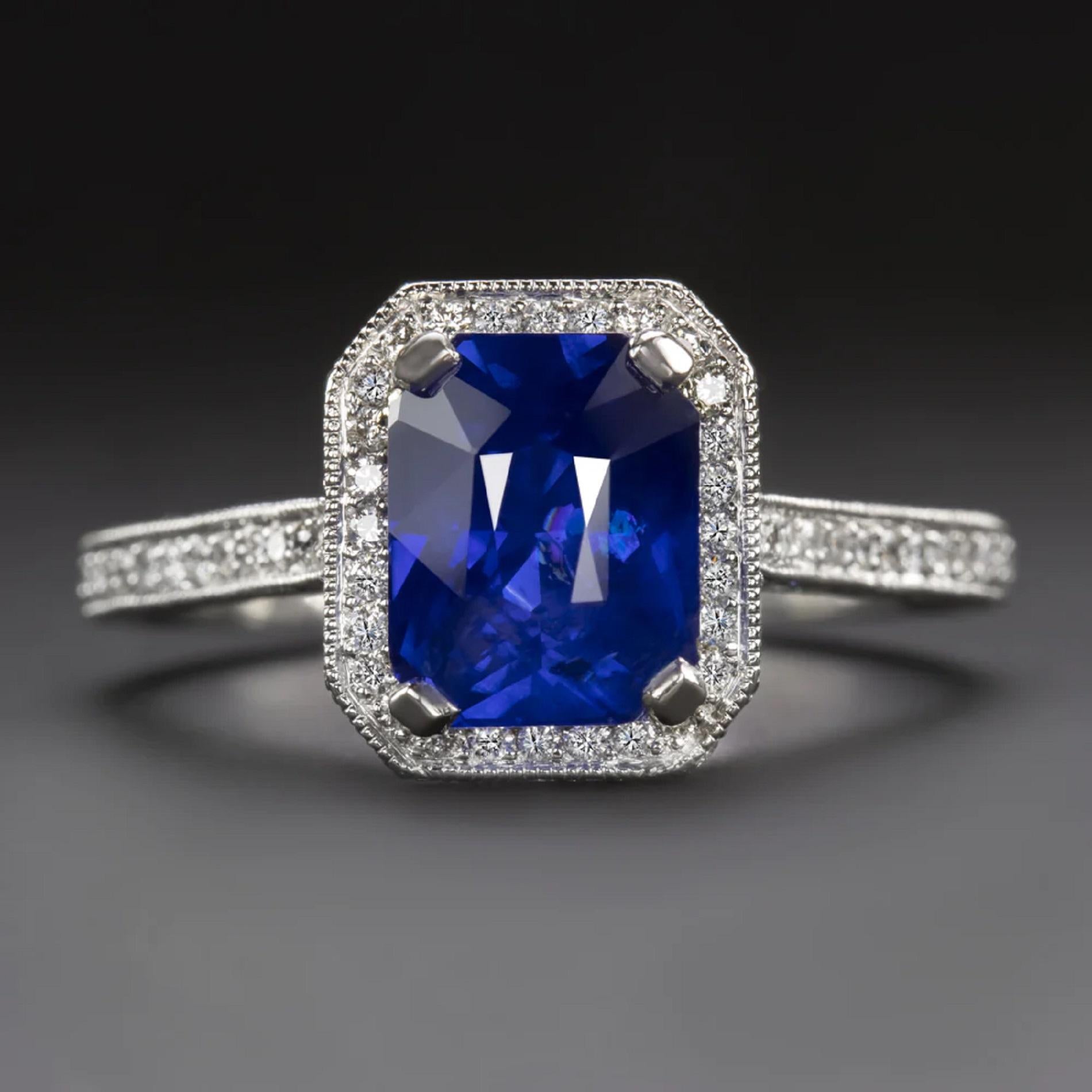 2.33ct natural sapphire center with gorgeous, rich color! It is a beautiful royal blue with the perfect depth of color.

- 1.25 carats of diamond accents add substantial sparkle

- Setting is diamond encrusted with diamonds on the sides of the halo