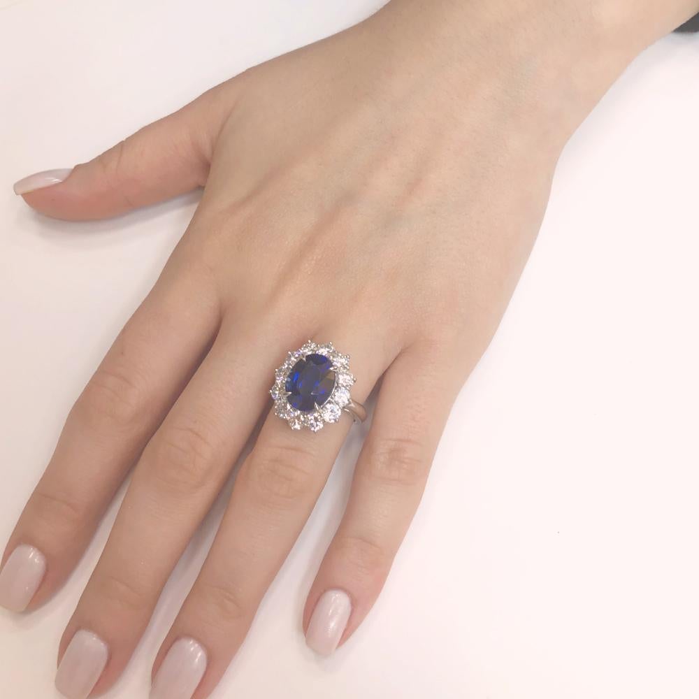 This ring is reminiscent of Princess Diana and Kate's royal cocktail engagement ring.
Classic, elegant and contemporary styled oval cut Ceylon blue sapphire 7.10 carat center stone.
Accented by round diamonds 2.28 carat total.
Diamonds are white and