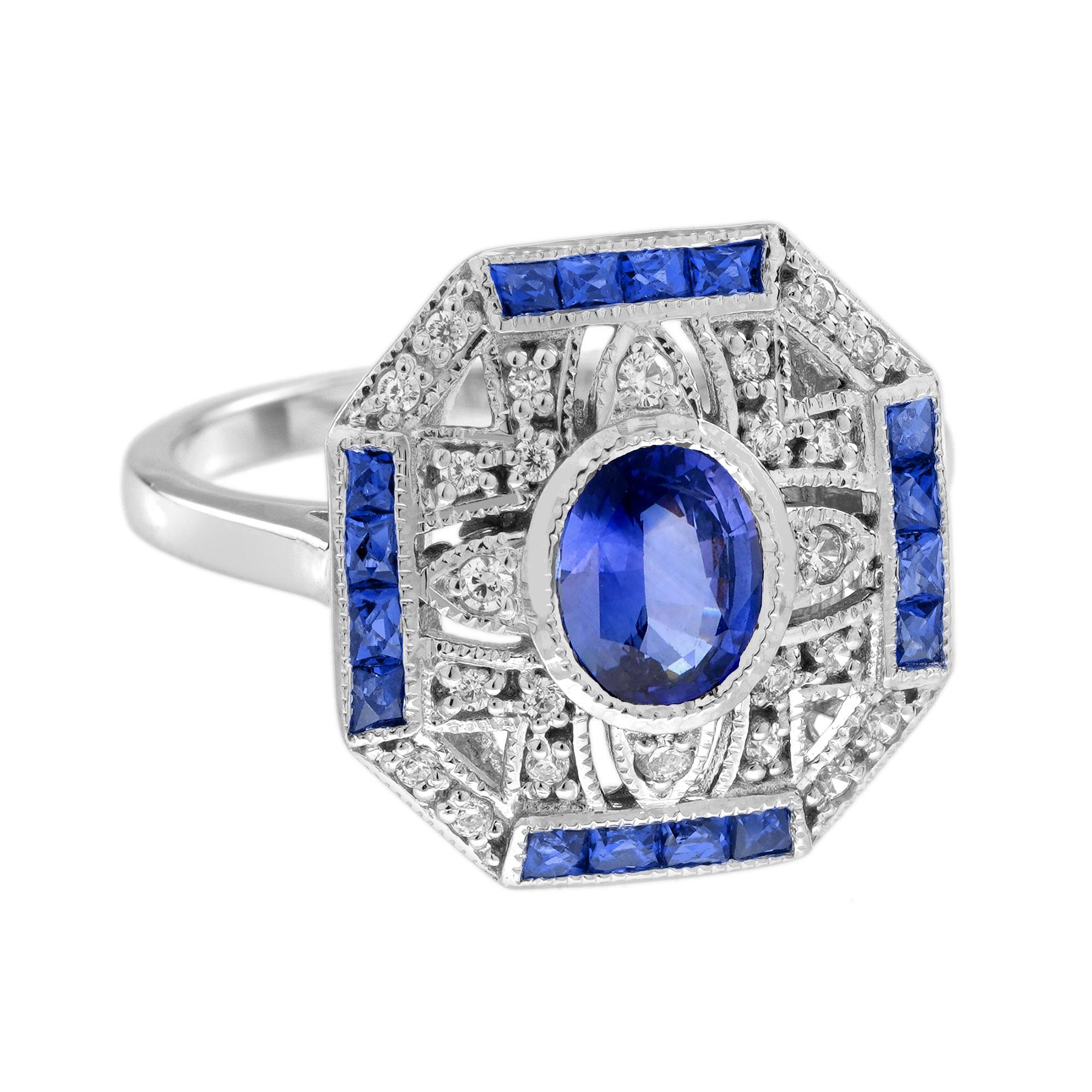 Features a stunning oval Ceylon sapphire at the center, surrounded by a halo of sparkling diamonds. The diamonds add brilliant twinkle and enhance the rich blue hue of the sapphire, creating a bold, sophisticated look. With its Art Deco-inspired
