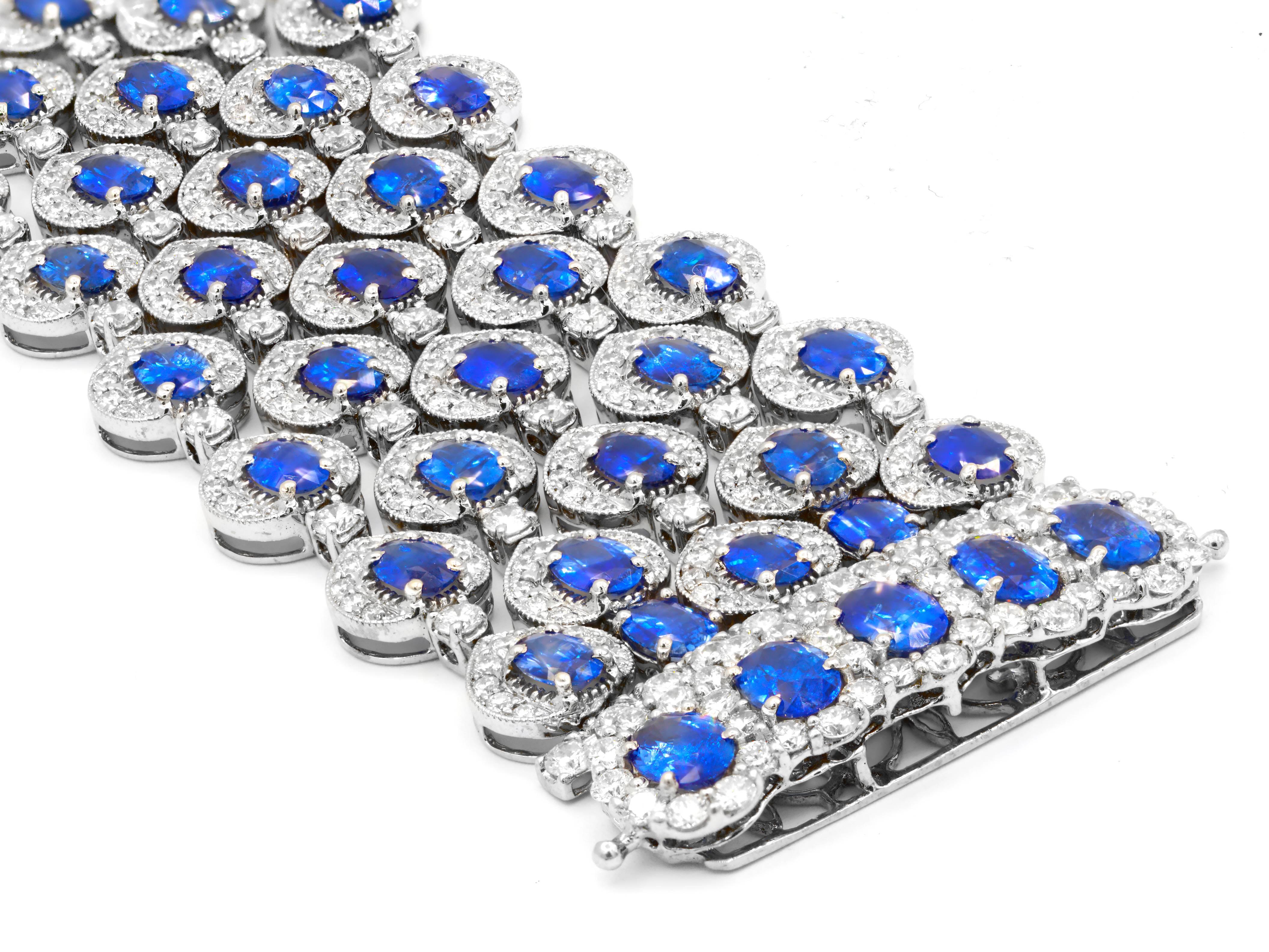 18K White Gold Wide Sapphire And diamond Bracelet featuires 36.57 carats of sapphires and 16.49 carats of diamonds. 1  1/4
