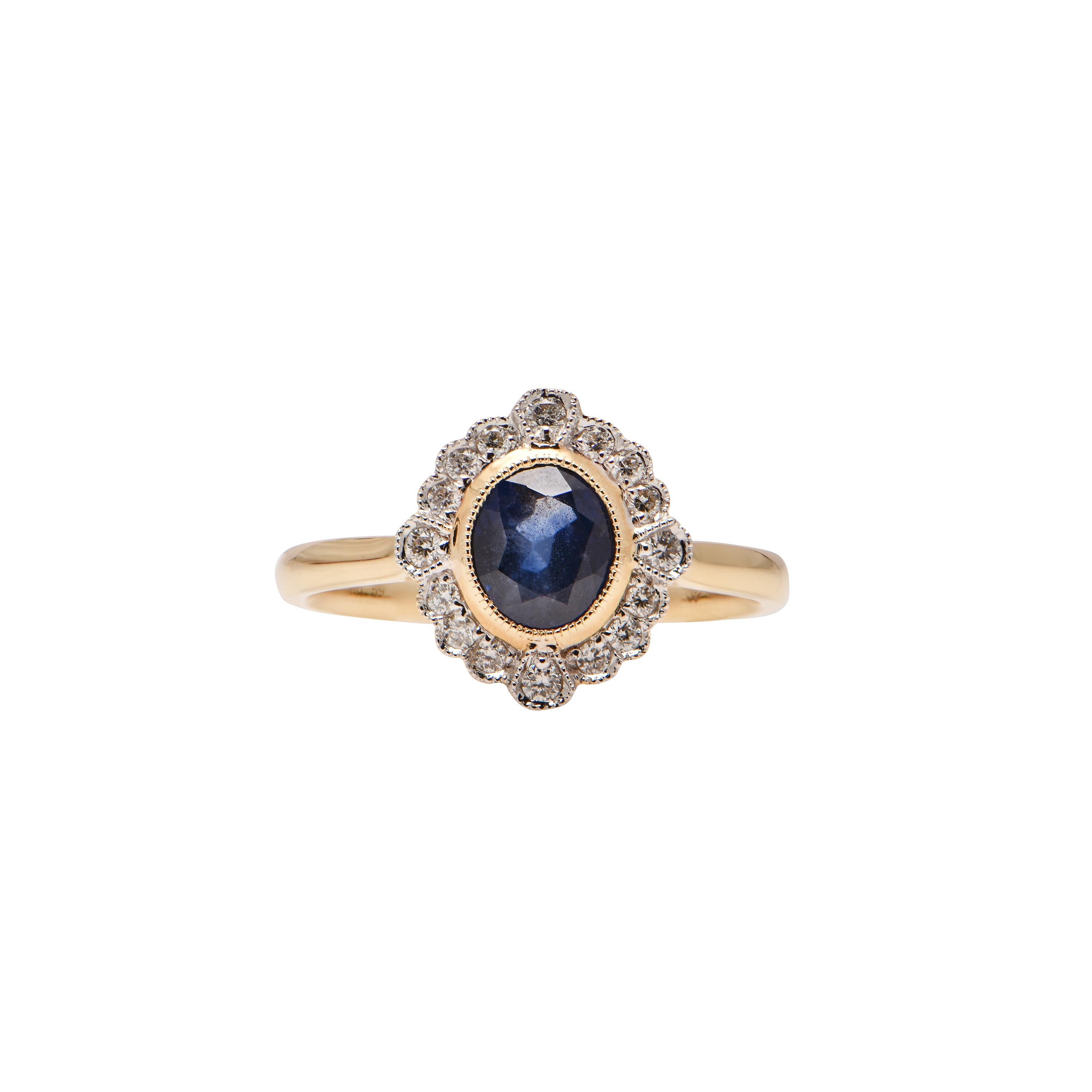 An 18ct Yellow Gold ring showcasing a Ceylon Sapphire (1.59ct), and 16 Diamonds totalling 0.18ct.