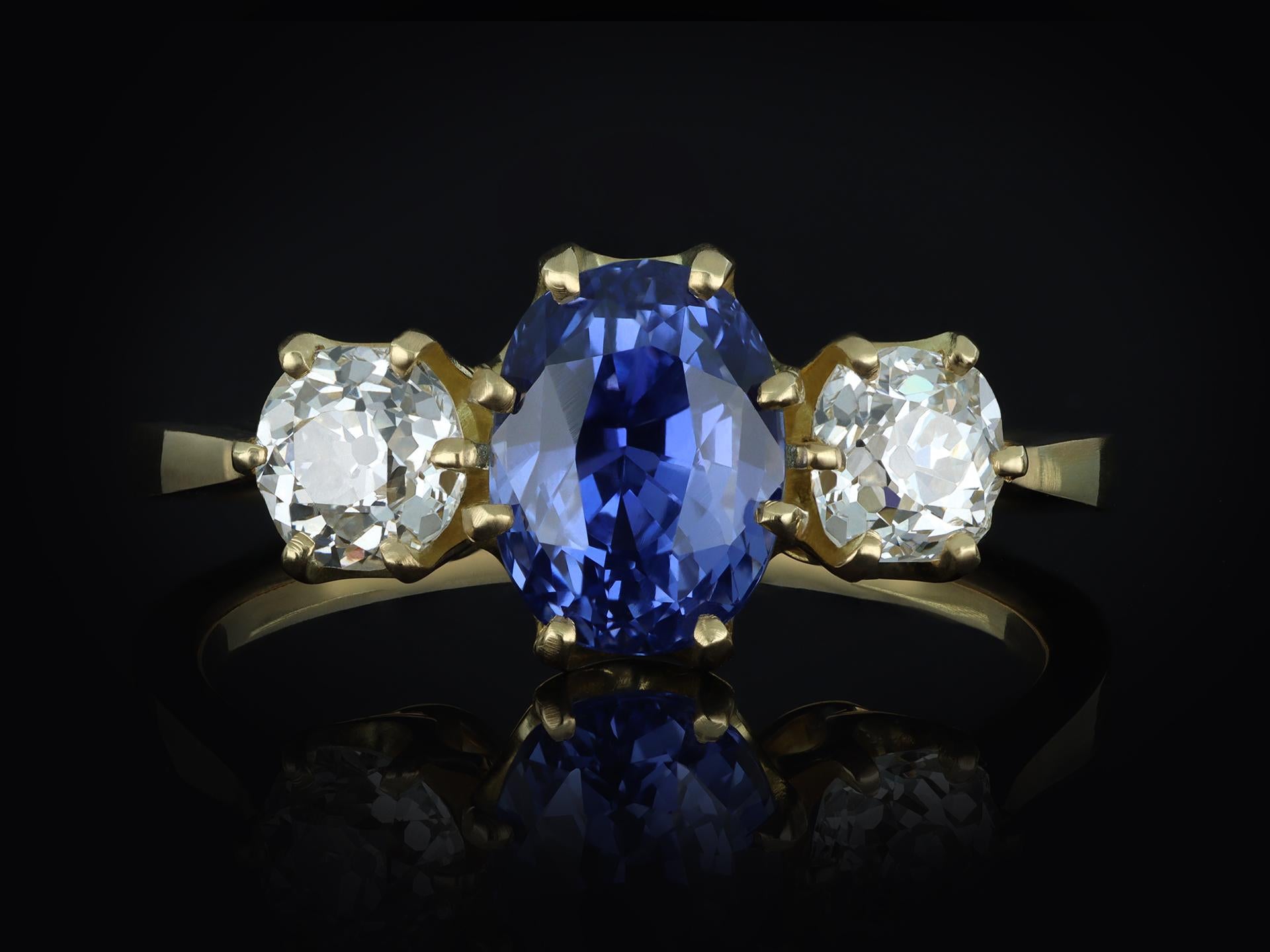 Ceylon sapphire and diamond three stone ring, circa 1900. 1