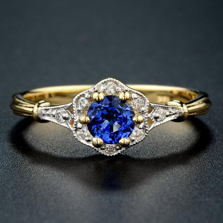 This vintage style ring was made in 18K Gold.  

The ring consists of... 
Center is Ceylon Sapphire from Srilanka weigh 0.55 Carat
Diamond 0.09 ct.   

The ring was made in size US#7